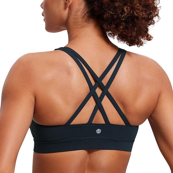 CRZ YOGA Women's Strappy Sports Bras Fitness Workout Padded Yoga Top Criss Cross Back Cami | Amazon (US)