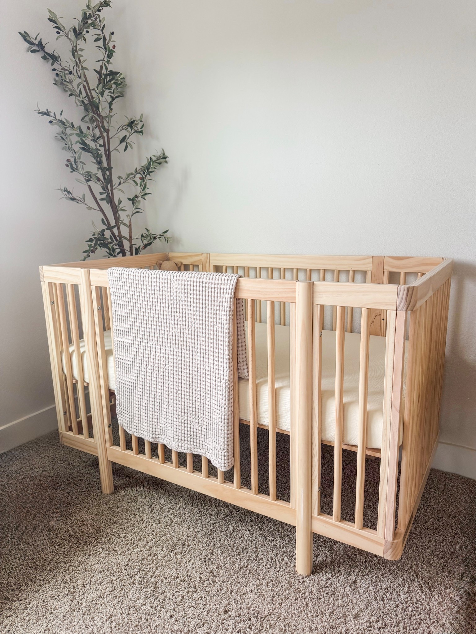 Neutral wood crib for a minimalist boho baby nursery 

#LTKBaby