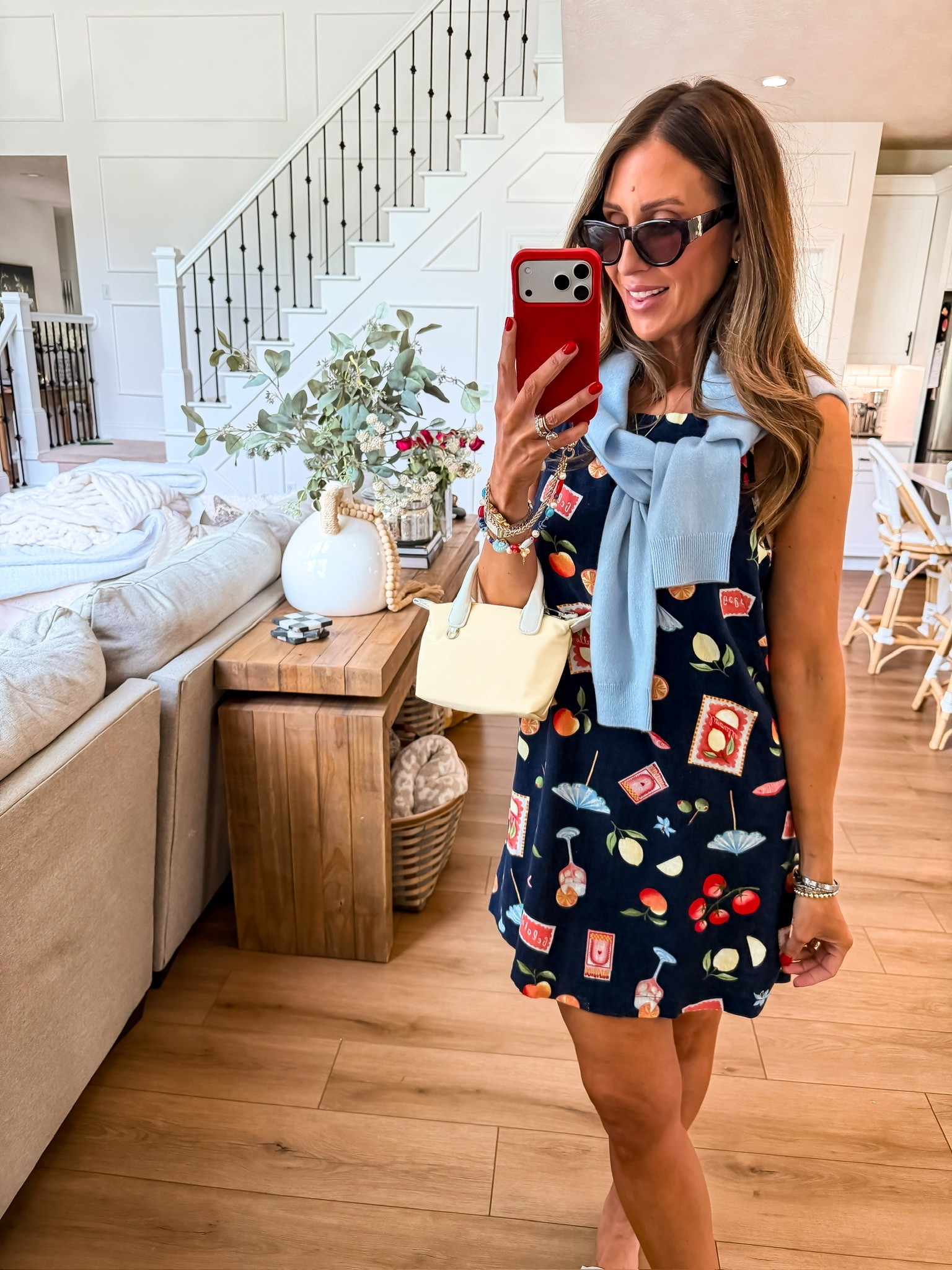 This printed mini dress is such a fun summer statement piece 🍒 I love the playful print mixed with the soft blue sweater and mini bag for an elevated preppy look that still feels effortless. Perfect for vacations, brunch, shopping days, or summer dinners by the water.

printed mini dress, preppy summer outfit, coastal style outfit, vacation dress idea, colorful summer fashion, playful print trend, sweater over shoulders outfit, casual chic summer look, resort wear style, feminine summer outfit, elevated everyday style, themominstyle

#LTKSeasonal #LTKTravel #LTKootd