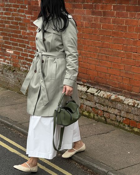 Spring transitional outfit 
White maxi skirt + short trench + Mary Jane flats + Loewe Puzzle bag

Skirt Aligne size 14
Trench Hobbs size 18
Mary Jane flats &Other Stories size 8
Bag Loewe Puzzle size Small
Wearing a green jumper underneath from &Other Stories size L

#LTKSeasonal #LTKbump #LTKworkwear