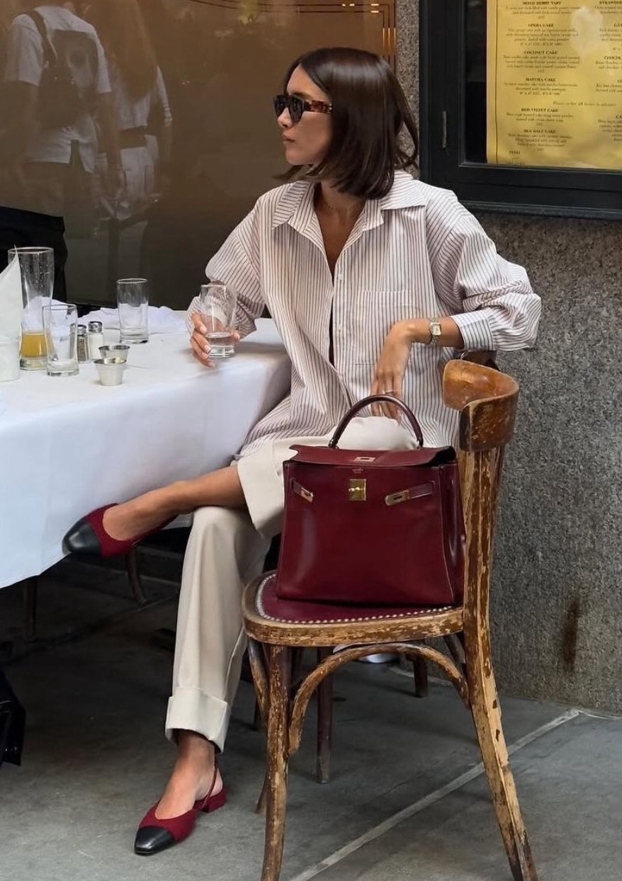 This chic everyday outfit pairs a relaxed striped button-down with tailored trousers and classic cap-toe flats for an effortlessly polished look.
Neutral tones with a rich burgundy bag and shoes add a sophisticated pop of color while keeping the outfit timeless and refined. 

 #LTKSpringSale #LTKootd