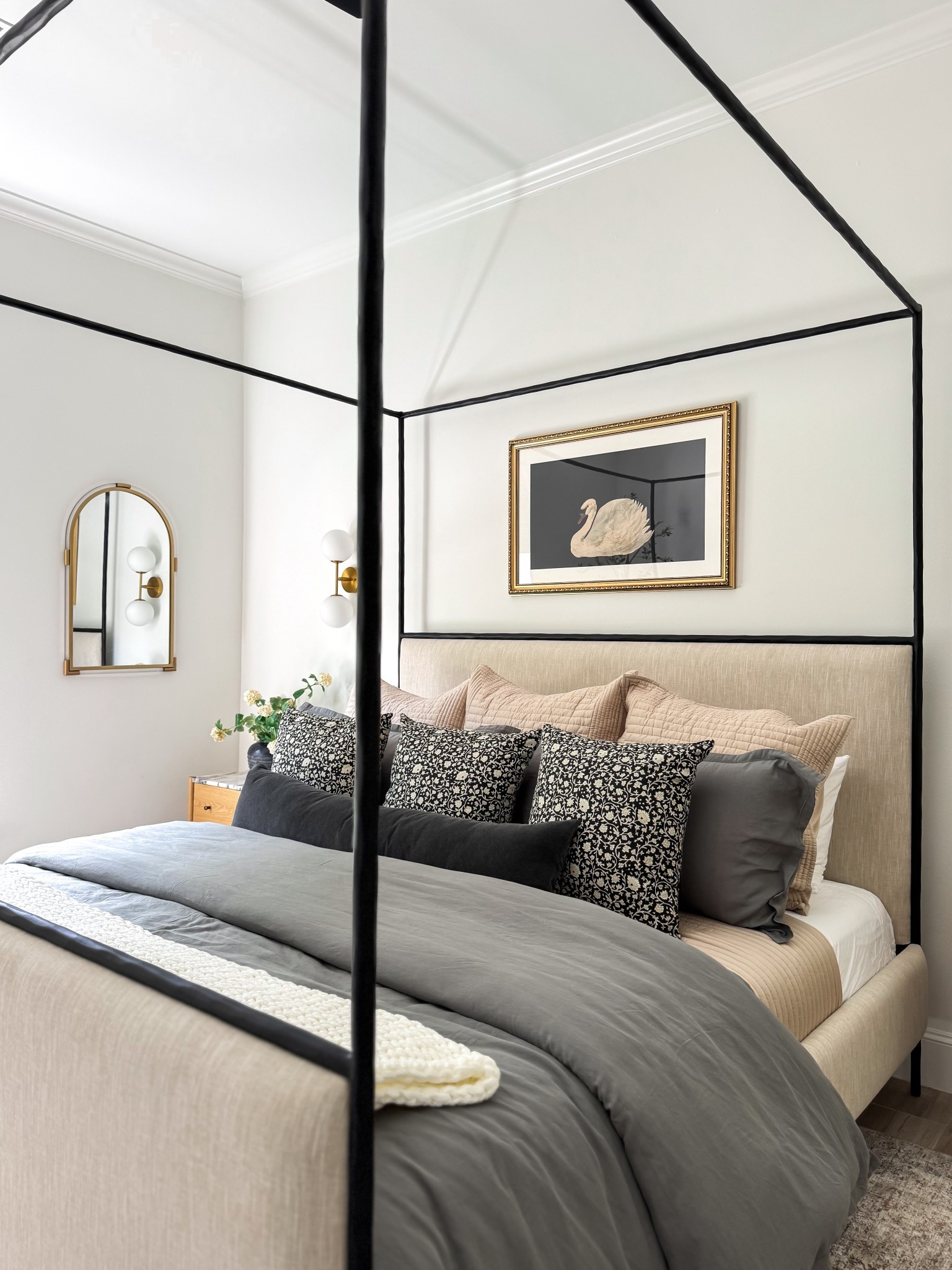 Our guest room is ready for its first guests! I have eyed this Crate and Barrel bed for years and she doesn’t disappoint.  Super heavy, high quality and that gorgeous iron frame is scrumptious.  Sold out ATM so I linked a similar bed. 

I went with lux bedding from West Elm.  The end tables are Lulu & Georgia and there’s a matching dresser on the other side of the room.  Amazon affordable decor adds the perfect touches like this under $100 swan artwork - a nod to my Grandma who had pet swans on her river house.   The rug is my forever favorite neutral rug that can seriously go in every room from Loloi. 

I’m still deciding on whether to paint the room / ceiling or do an accent wall behind the bed.  What would you do? 

I had an electrician hard wire the sconces and add switches next to each side of the bed for guests to easily turn on them on.  They provide the perfect ambience!

#LTKFindsUnder100 #LTKHome