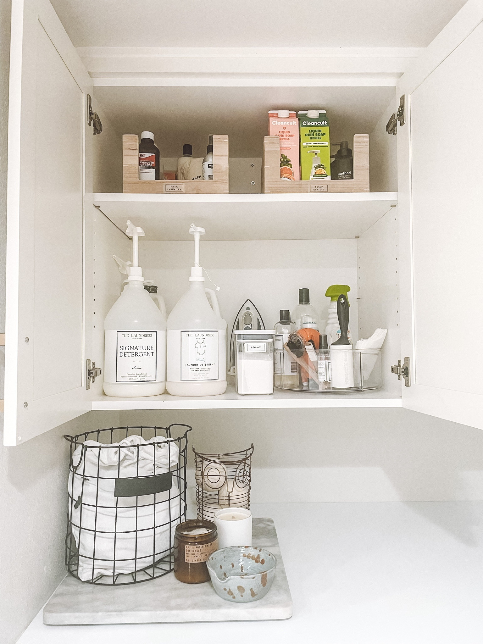 Laundry room organization. IDesign Linus 9” Divided Turntable. Home Edit Wooden Open Front Bin. Design Ideas Harvest Basket. Amazon Laundry Liquid Dispenser✨

#LTKfamily #LTKhome #LTKkids