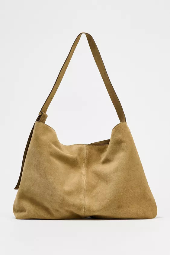 Maxi bucket bag in split suede. Topstitching detail on the top. Shoulder strap with adjustable cr... | Zara UK