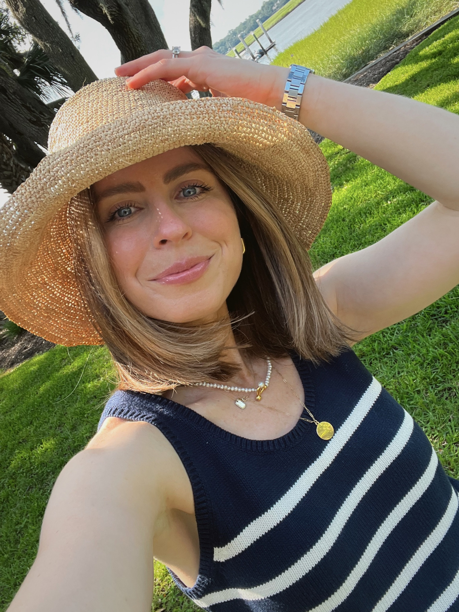 Jenni kayne raffia bucket hat 
Kule knit striped tank 

#LTKstyletip #LTKtravel