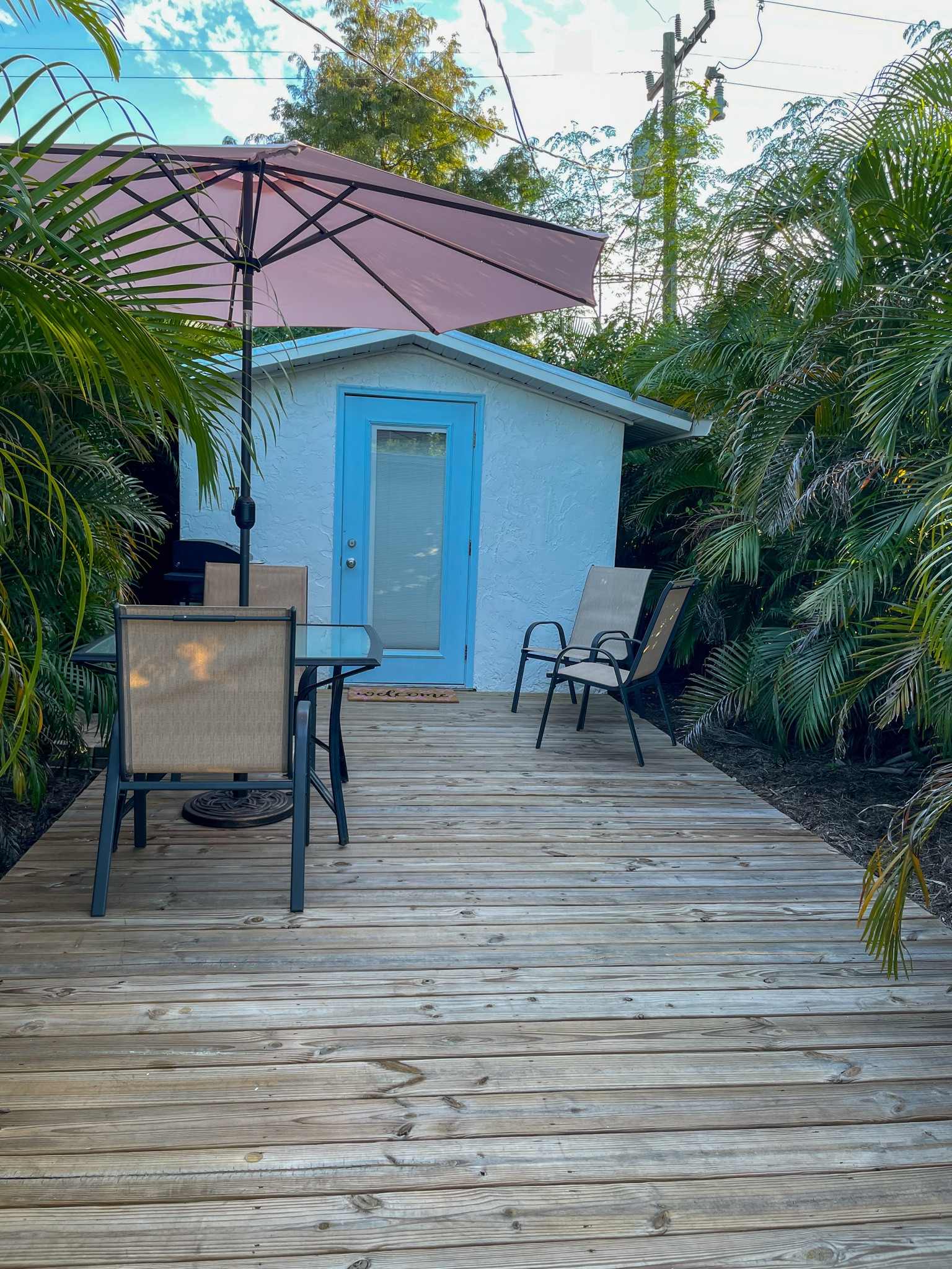 Private tropical deck leading into your relaxing Pink Casita stay.