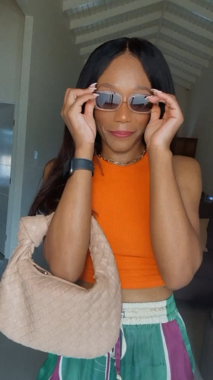 No vacation is complete without a pair of flowy pants. Paired these silk pants with a simple orange cropped tank. 
#amazonfinds #amazon #vacationoutfit #vacationstyle #flowypants #silkpants #orangetop #sunglasses #linknecklace

#LTKtravel #LTKSeasonal #LTKitbag