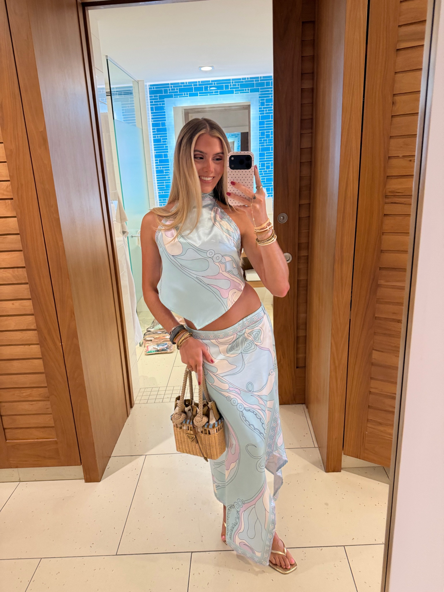 My outfit for the night in the Bahamas my matching skirt set is amazon! Amazon size small Wuitrie Two Piece Skirt Set for Women Summer Fashion Printed Satin Hanging Backless Top Irregular Midi Skirt Trendy Set. It’s a pucci look for less. My kitten heels are from Walmart. My bag is @Vivrelle   my code is SLOANEVOSEN. My perfume is @NOYZ

#LTKootd #LTKTravel #LTKdayinmylife