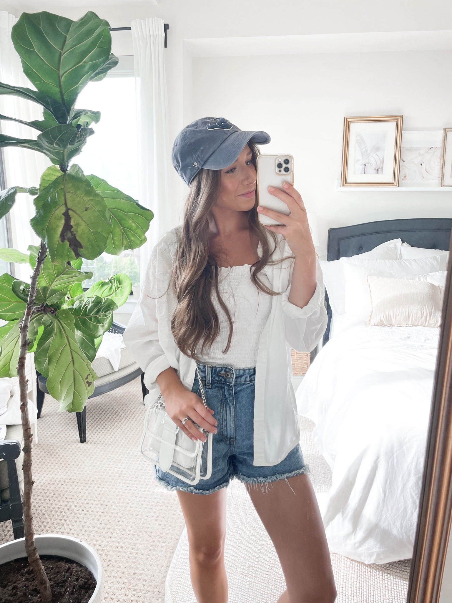 Game day outfit inspiration: smocked strapless top with a white collared shirt and mom shorts. I absolutely love this clear game day bag with a white insert! 

#LTKstyletip #LTKunder50