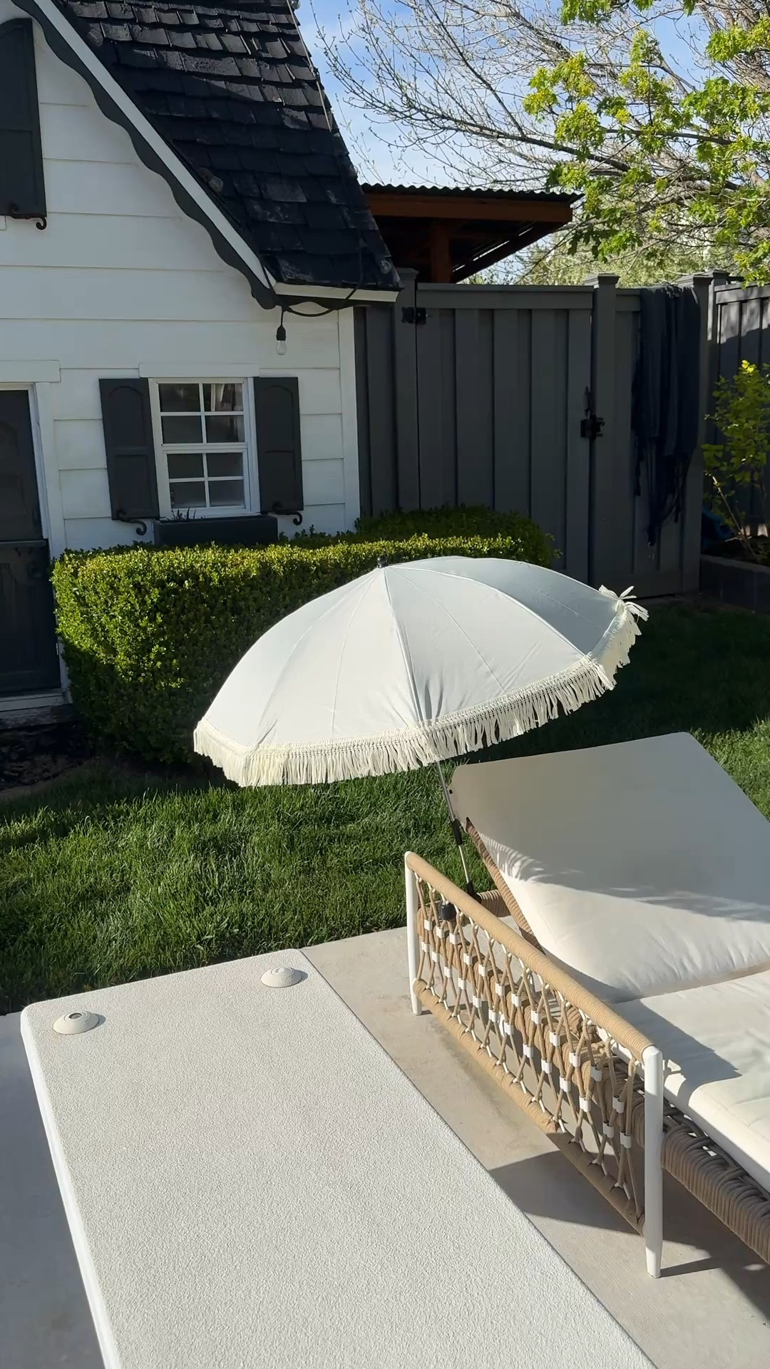 Chair, side table, and umbrella details 