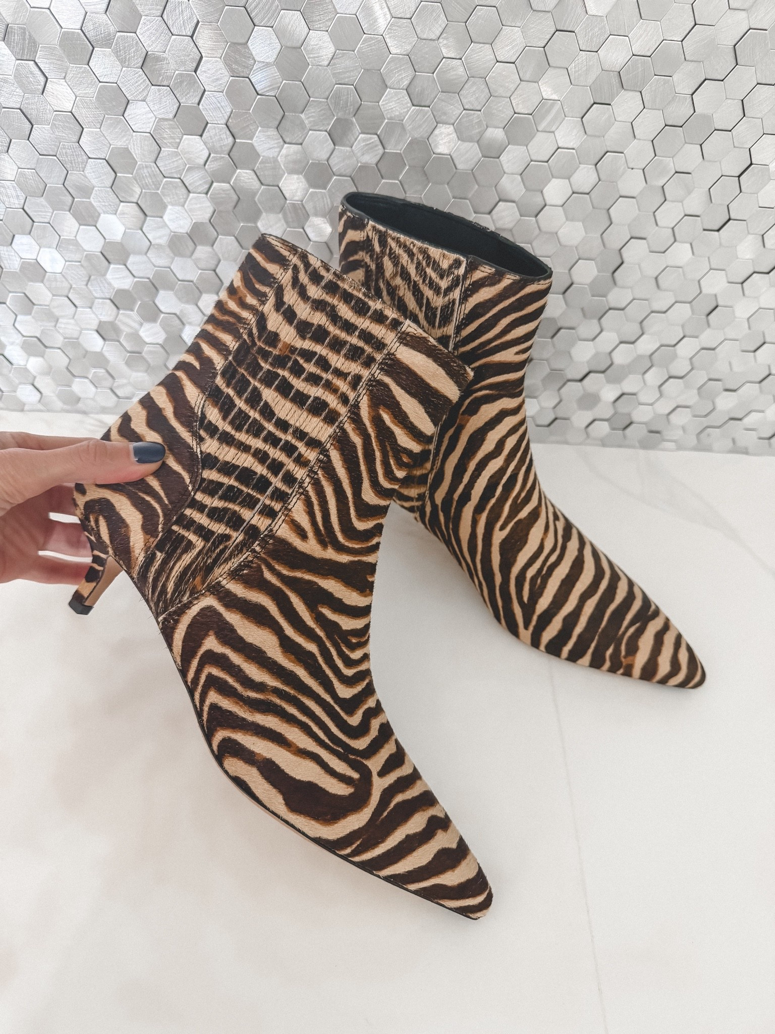 These zebra ankle booties are guaranteed to make any fall outfit more fabulous! The pointed toe and kitten heel feel sleek and feminine, while the animal print adds the perfect statement-making touch. #LTKShoeCrush

#LTKSeasonal#LTKOver40 

 