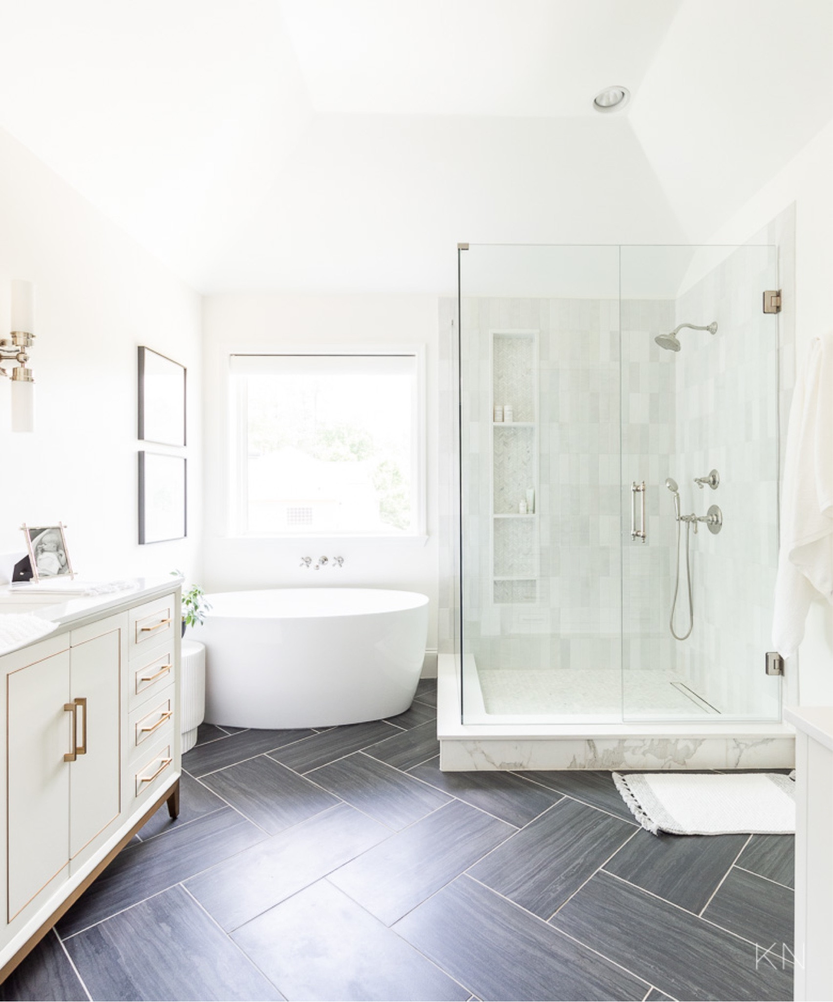 Our primary bathroom remodel was one of the biggest projects we’ve ever done. My favorite features are the three different tiles we used: black floor tile set in a herringbone pattern, vertical shower wall tile and chevron marble mosaic tile for the shower floor and shower niche. home decor bathroom decor white vanity fluted side table freestanding tub #LTKStyleTip

#LTKHome