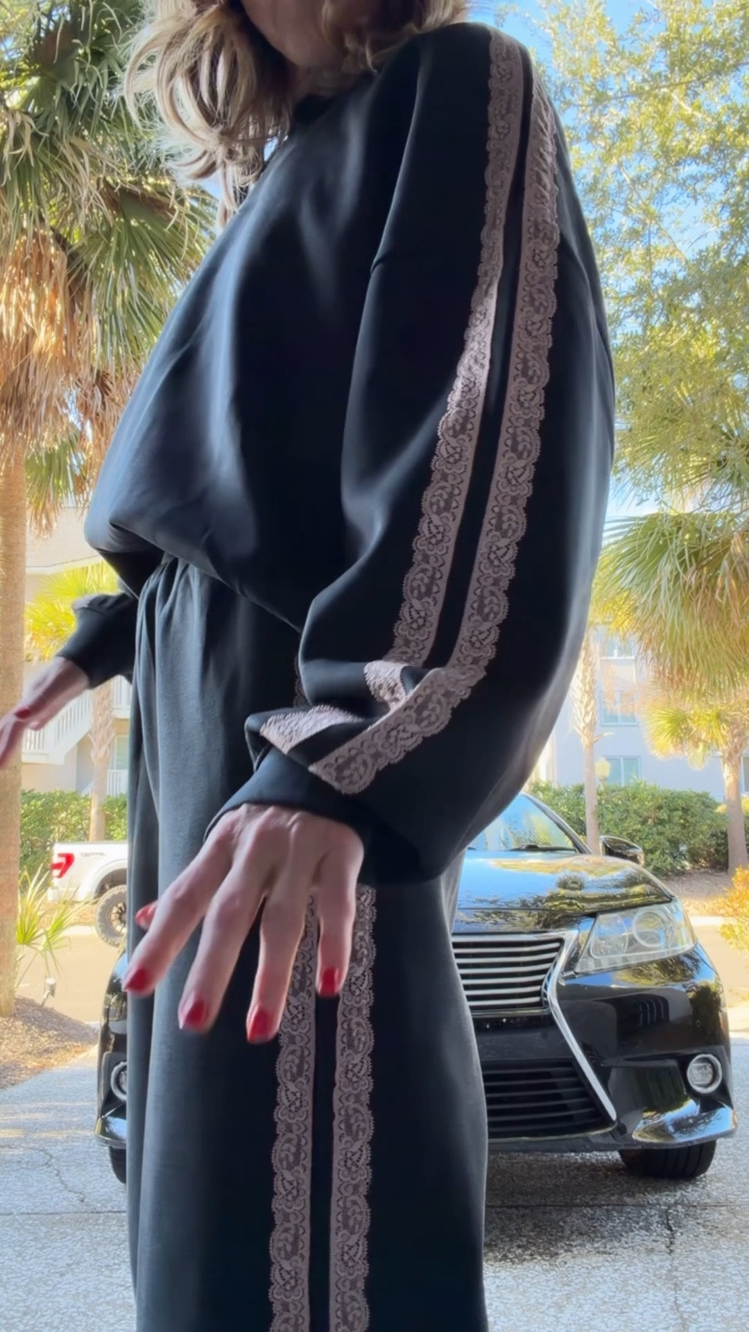 Airy sleek sweatshirt is made from a fabric blend of recycled polyester, rayon and spandex for easy movement. Designed with a relaxed fit and finished with lace-trim detailing for a touch of chic style. Crew neckline and banded hem complete the look with a snug feel. Wearing a small in both 