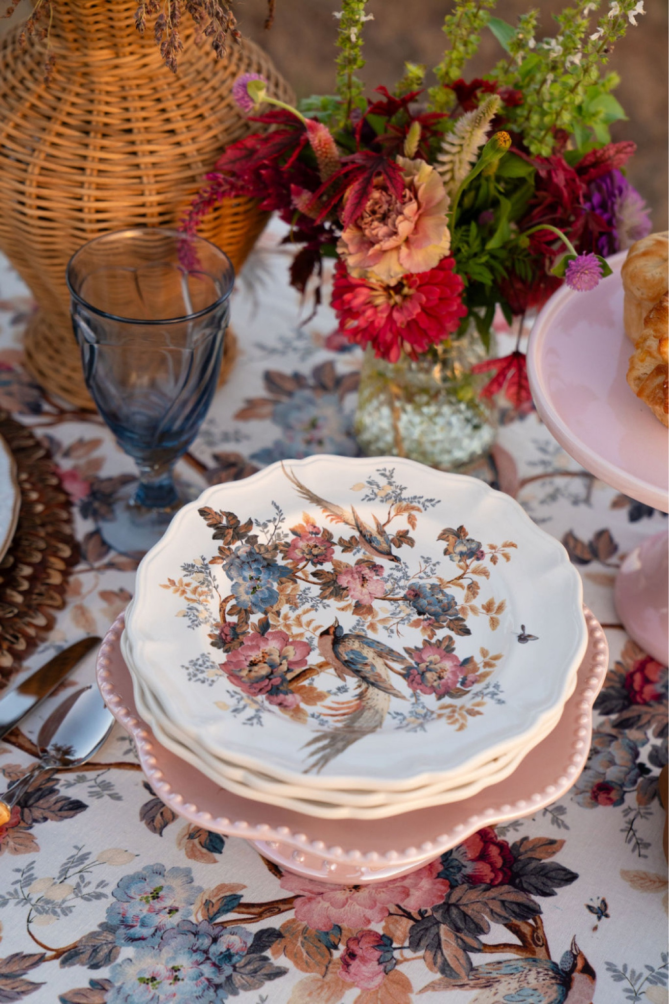 Fall is the best time of year for Al fresco dining and this beautiful blue, white, and bronze fall harvest Tablescape will surely impress. Decorate your table with florals this fall and elegant blue and white tableware. A printed floral table cloth is also necessary! BLUE AND WHITE TABLESCAPE. BLUE AND WHITE PLACE SETTING. BLUE AND WHITE CHINA. BLUE AND WHITE PLATES. FLORAL TABLE DECOR. FLORAL TABLE CLOTH. FALL HARVEST TABLE. FALL HARVEST TABLE SETTING. 

#LTKSeasonal #LTKhome