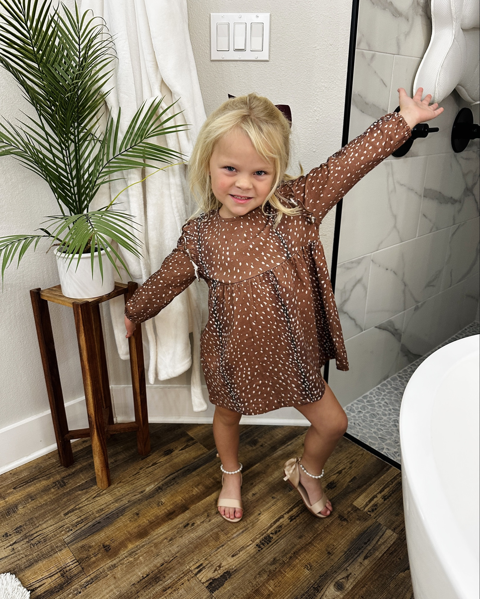 Fall Wedding Little Girl Outfit! 🍂 

This fall wedding look was everything — timeless, comfy, and so easy to put together! My little girl wore this outfit over the weekend, and I’m officially saving it as one of my favorites for fall weddings or family photos. 🤍 

Dress: This fawn print is adorable and I got it from Piper Jo and Co Boutique- https://piperjoandco.com/products/cora-dress-fawning-over-you?variant=47893317058802 

Shoes: Stunning -  Champagne & Pearls are perfect for wedding anytime of year. I can’t believe how fast these came in. If you need a last minute sandal click the link below ⬇️ 

Hair: 1/2 up/down Curls + hair bow (linked a few favs below) 

Wedding Outfit | Fall Family Wedding | Family Photos | little girl style | wedding shoes | dress | hair bow 

#LTKBeauty #LTKKids #LTKShoeCrush