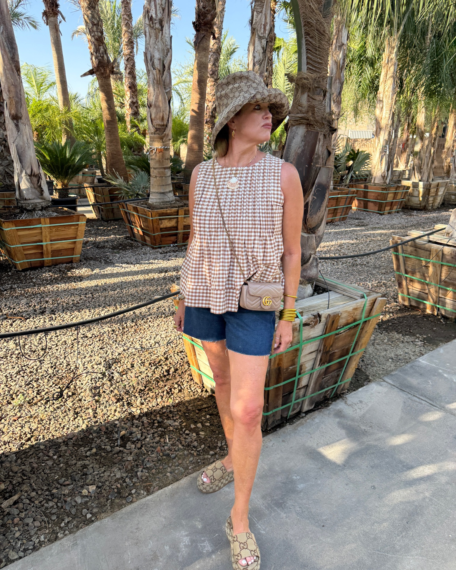 Summer short outfit over 50
Perfect for Travel and site seeing 

Spanx 5 inch raw hem denim shorts in dark wash fit tts and do comfy
Comes in 3 washes 
Save 15% with code Deardarcyxspanx 

Gucci slide platform sandals 
Tts, Gucci logo  hat and Gucci quilted mini bag 

Budha girl bangles and Julie Vos hoops

Amazon gingham baby doll top flattering and so cute comes in several colors, tts

#LTKootd #LTKOver40 #LTKSaleAlert