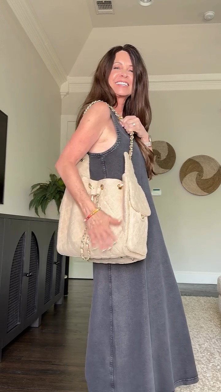 An organic cotton v neck midi dressed in a washed black color. Longer on me at a petite 5’1”.  Paired with a terry cloth tote and my favorite white Keds.

Running quick errands on a hot day calls for a loose fitting dress and comfortable sneakers.