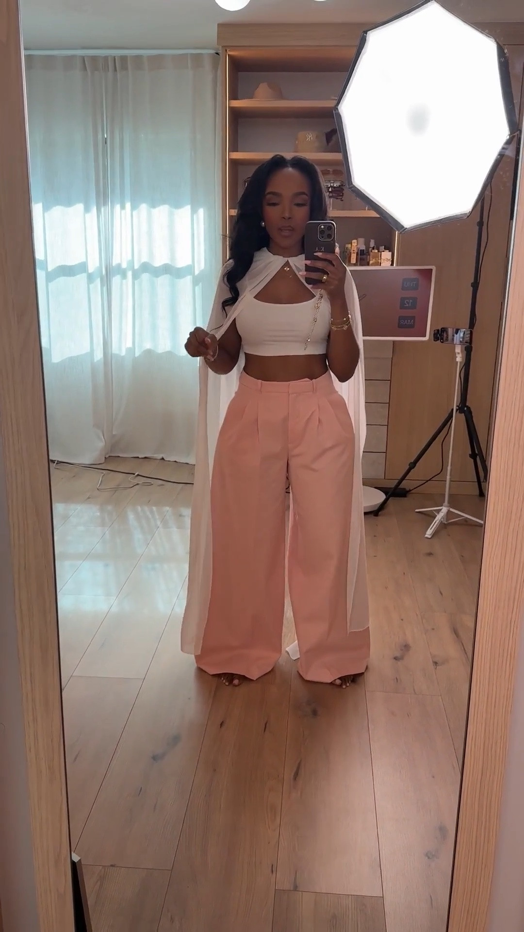 Hi Babes!

This outfit is the definition of feminine power dressing ✨🤍🌸

The soft blush trousers paired with the dramatic white cape detail create such a chic, elevated look. It feels polished, expensive, and fashion-forward while still being incredibly wearable.

I love pieces like this because they make a statement without needing a lot of accessories. The silhouette does all the work.

Where to wear this:
• Bridal events
• Networking events
• Birthday celebrations
• Upscale brunches
• Fashion-forward date nights

Style tip: Keep accessories minimal and let the cape detail be the star of the outfit.

Undergarments: Seamless nude bra and underwear recommended.

Everything is linked below

xx Kira | IG: KirasFashionFinds

34D - 27 - 40 • Size Small or 4