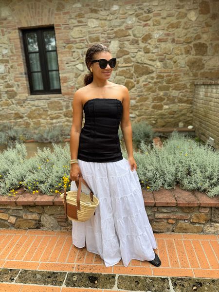 Italy summer outfit! White maxi skirt with a black linen sleeveless top, straw bag, Madewell Greta ballet flats, gold jewelry, and sunglasses. Top & skirt are from Dissh, linking similar options as well!

#LTKSeasonal #LTKTravel