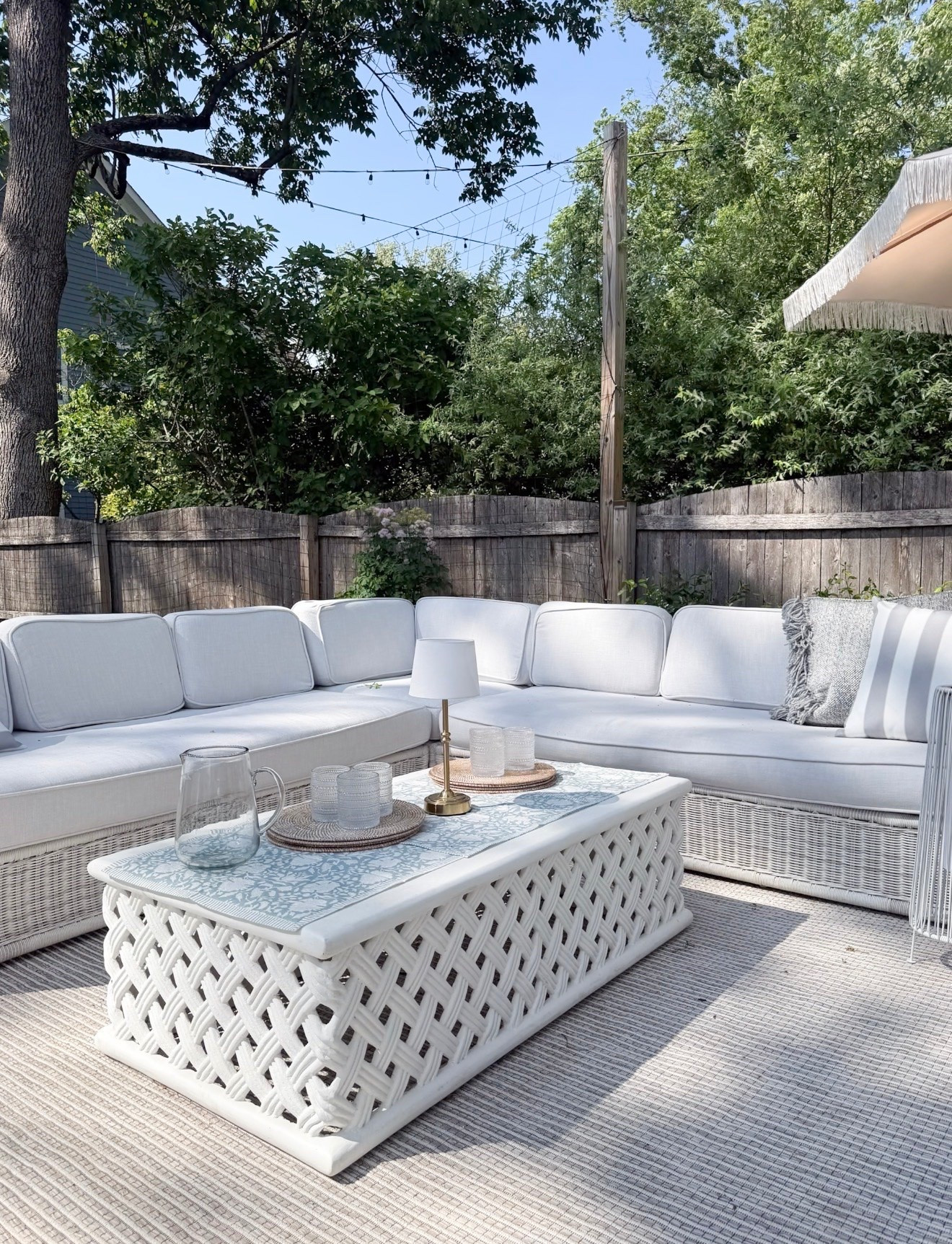 This outdoor rug is the quiet detail that makes the whole seating area feel pulled together. The subtle neutral stripe adds texture under the white wicker furniture while keeping the patio light and relaxed.

outdoor area rug, striped outdoor rug, neutral patio rug, outdoor living space, patio seating area, backyard decor, outdoor sectional, neutral outdoor decor, woven patio furniture, outdoor entertaining, girlonthehudson

#LTKSeasonal #LTKHome