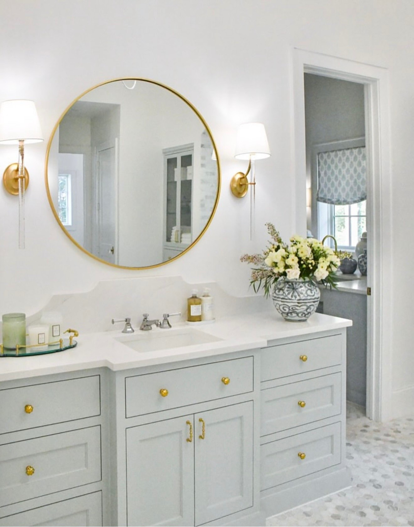Primary bathroom vanity decor
Bathroom tray, light sconces, faucet, vase, mirror, cabinet knobs, cabinet pulls 

#LTKHome