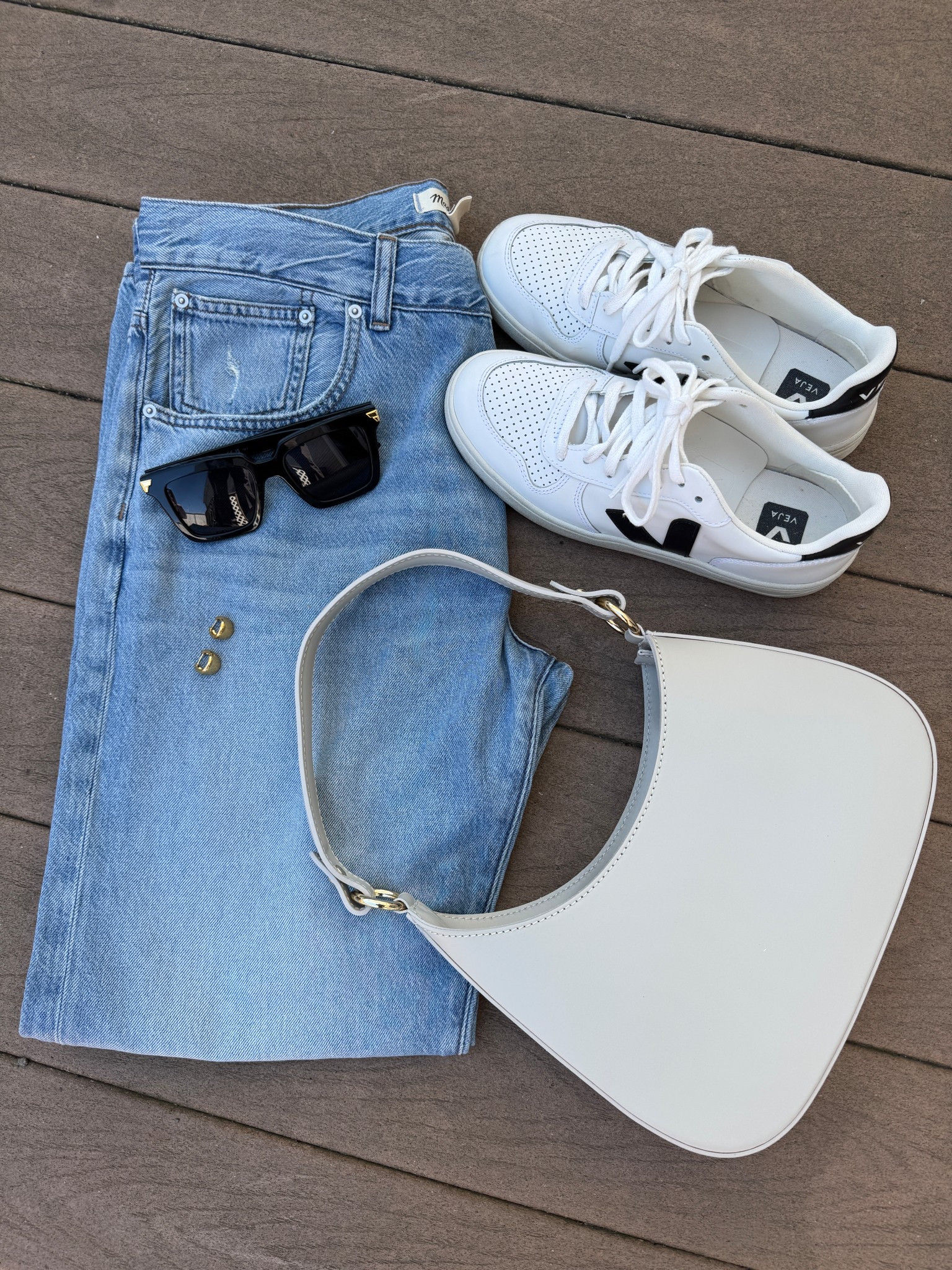 Everyday staples 😎

Softest jeans 👖 I’ve tried!! This Madewell pair feels like heaven. These come in a regular and curvy fit. Size up if you’re in between sizes.
Veja sneakers 👟- great leather sneakers that elevate a simple outfit. 
Leather Shoulder bag 👜 from TJ Maxx for $50 - awesome find 😍

My go-to accessories - Bottega sunglasses 🕶️ and Monica Vinader earrings ✨

#LTKStyleTip #LTKFindsUnder100 #LTKFindsUnder50