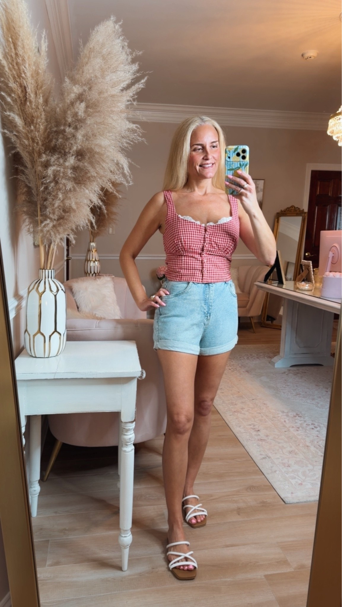 A cute summer outfit with cuffed denim high rise mom shorts and a red and white gingham cotton top. So cute for a barbecue or casual day. ￼

#LTKgrwm #LTKootd #LTKdayinmylife