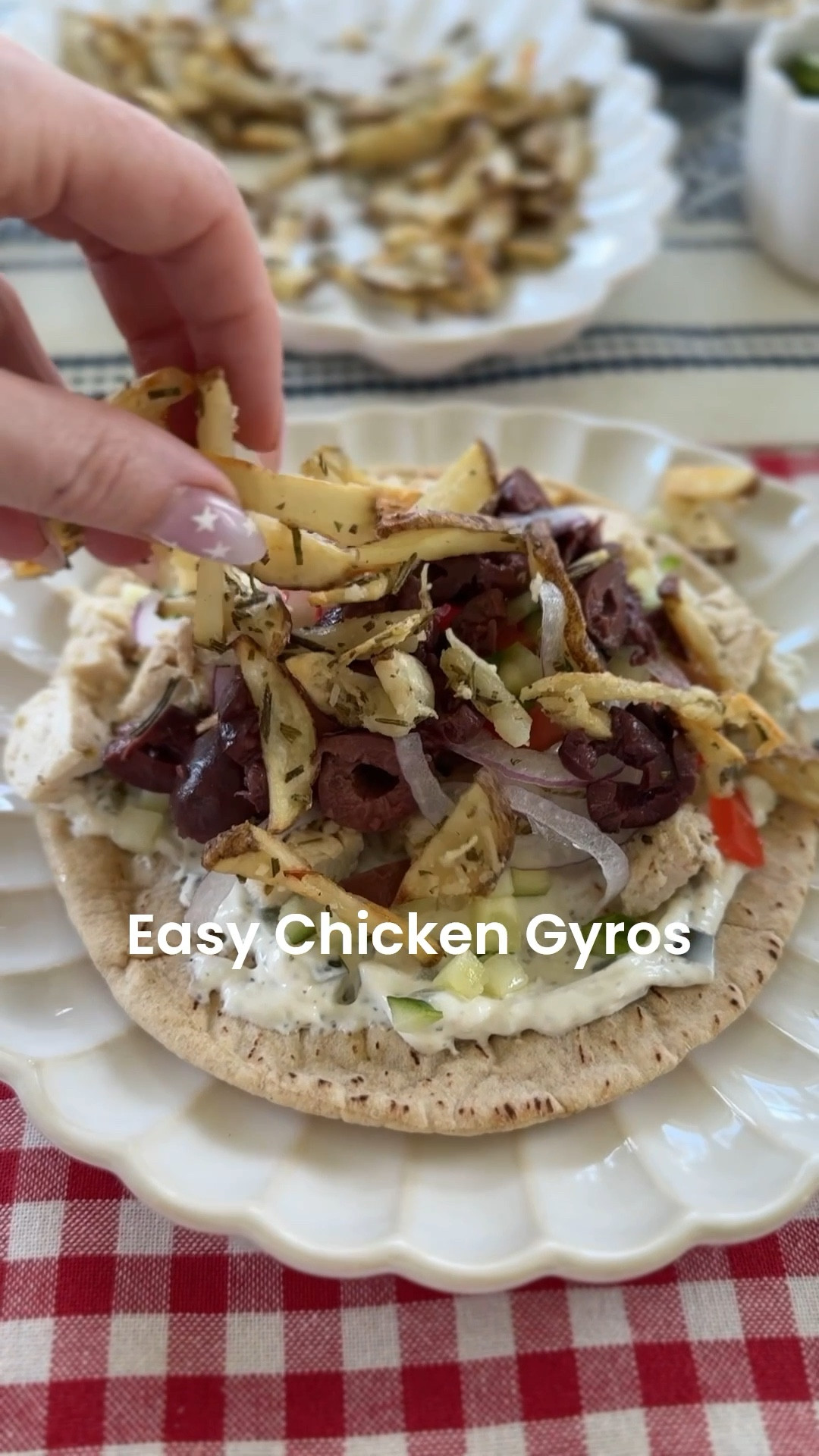 Easy Greek (ish) chicken gyros with my July 4th table scape. 😂🇺🇸 Recipe at the end  and I tagged my fave low carb 60 cal pitas. 🥙  I sliced the potatoes with my mandolin and then sliced them into fries. And pioneer woman makes a cute chopping box now that’s a best seller! 