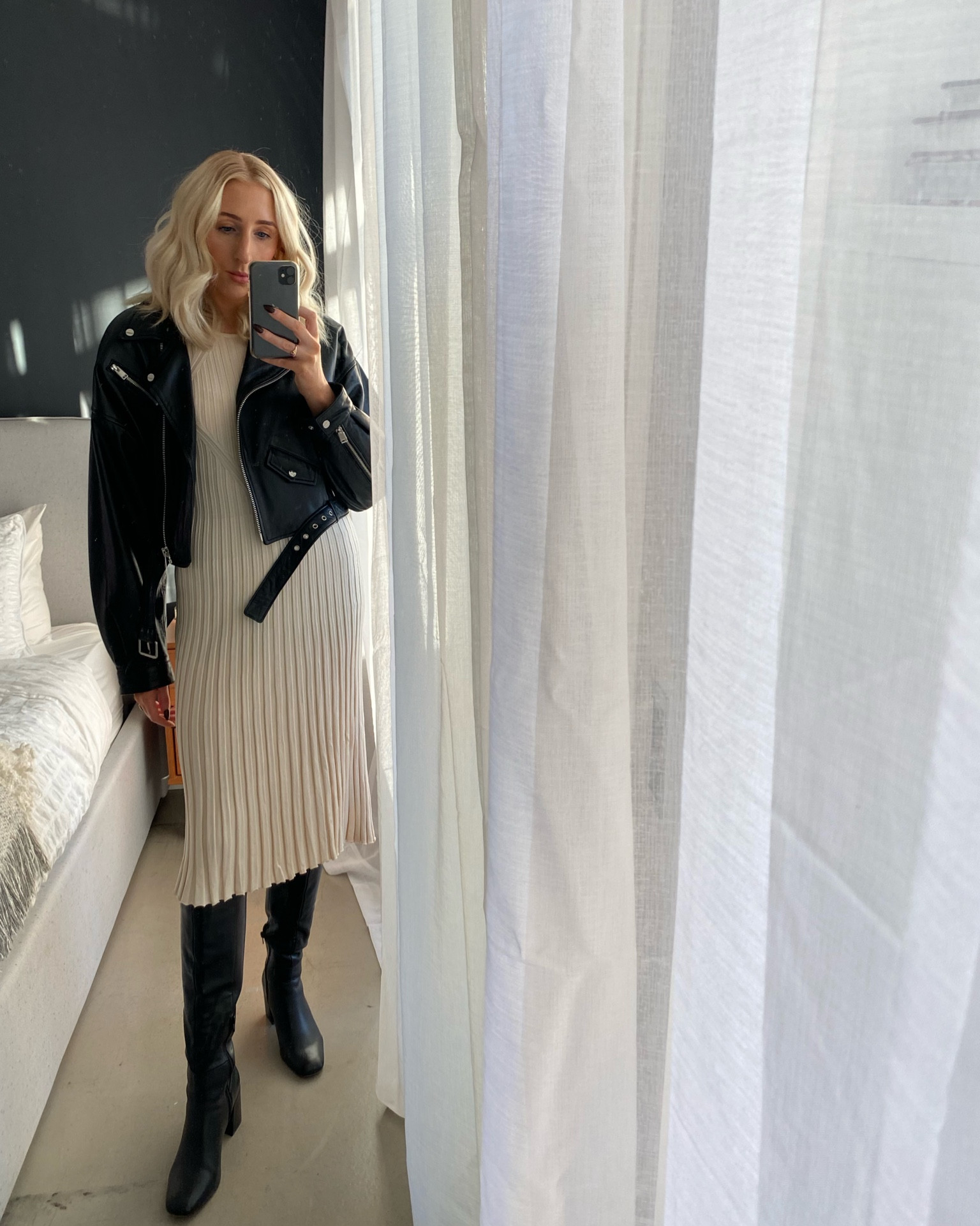 White dress, leather jacket, tall boots, holiday outfit ideas, winter outfit, transitional style, holiday party looks 