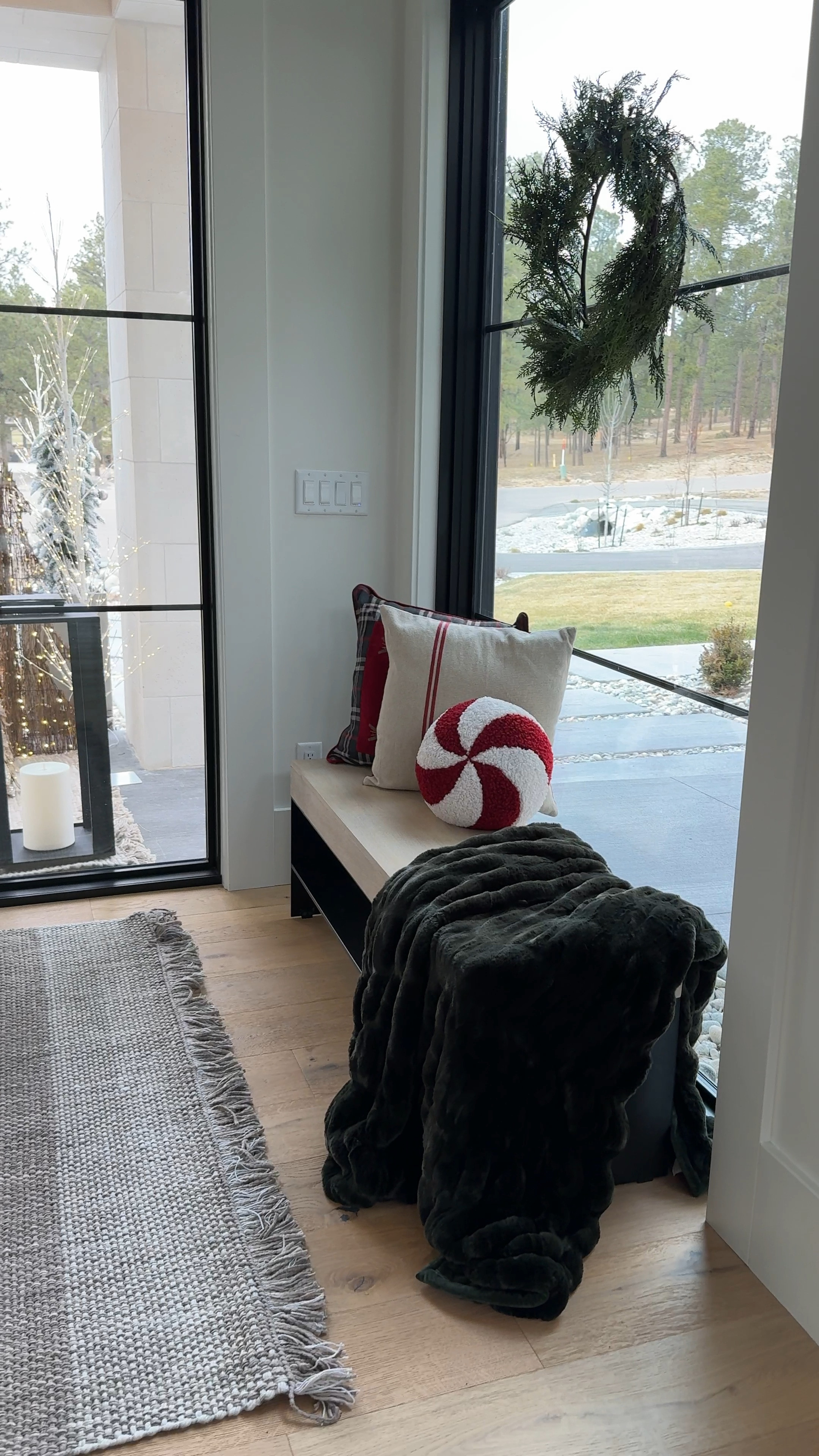 Our holiday porch decor! Finally added a bench and it had been game changing! The cayman bench from Pottery Barn is the perfect mix of modern and industrial. 

#LTKsalealert #LTKHoliday #LTKhome