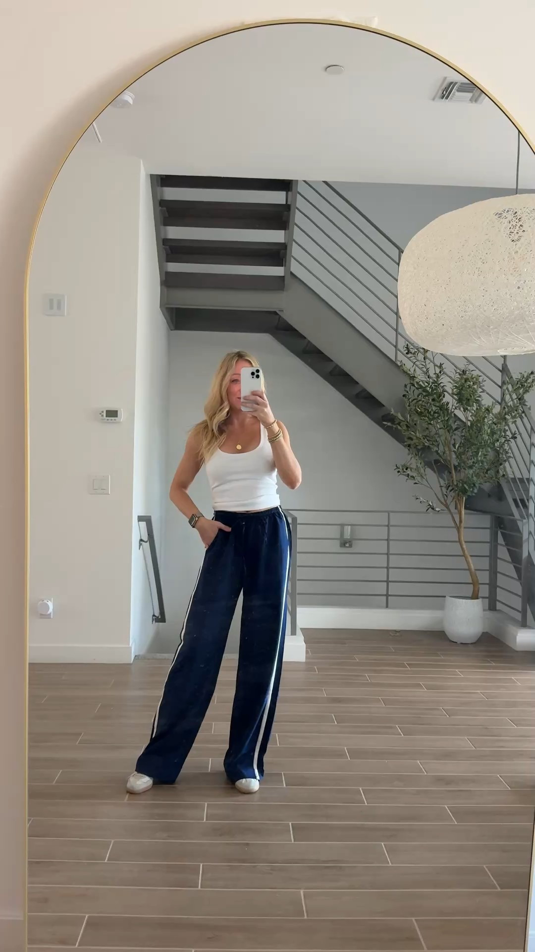 Track pants under $30- amazing! Wearing size small tall, I’m 5’6”! No bra tank I’m wearing size small as well. Love this easy trendy outfit! 

#LTKootd #LTKdayinmylife #LTKActive