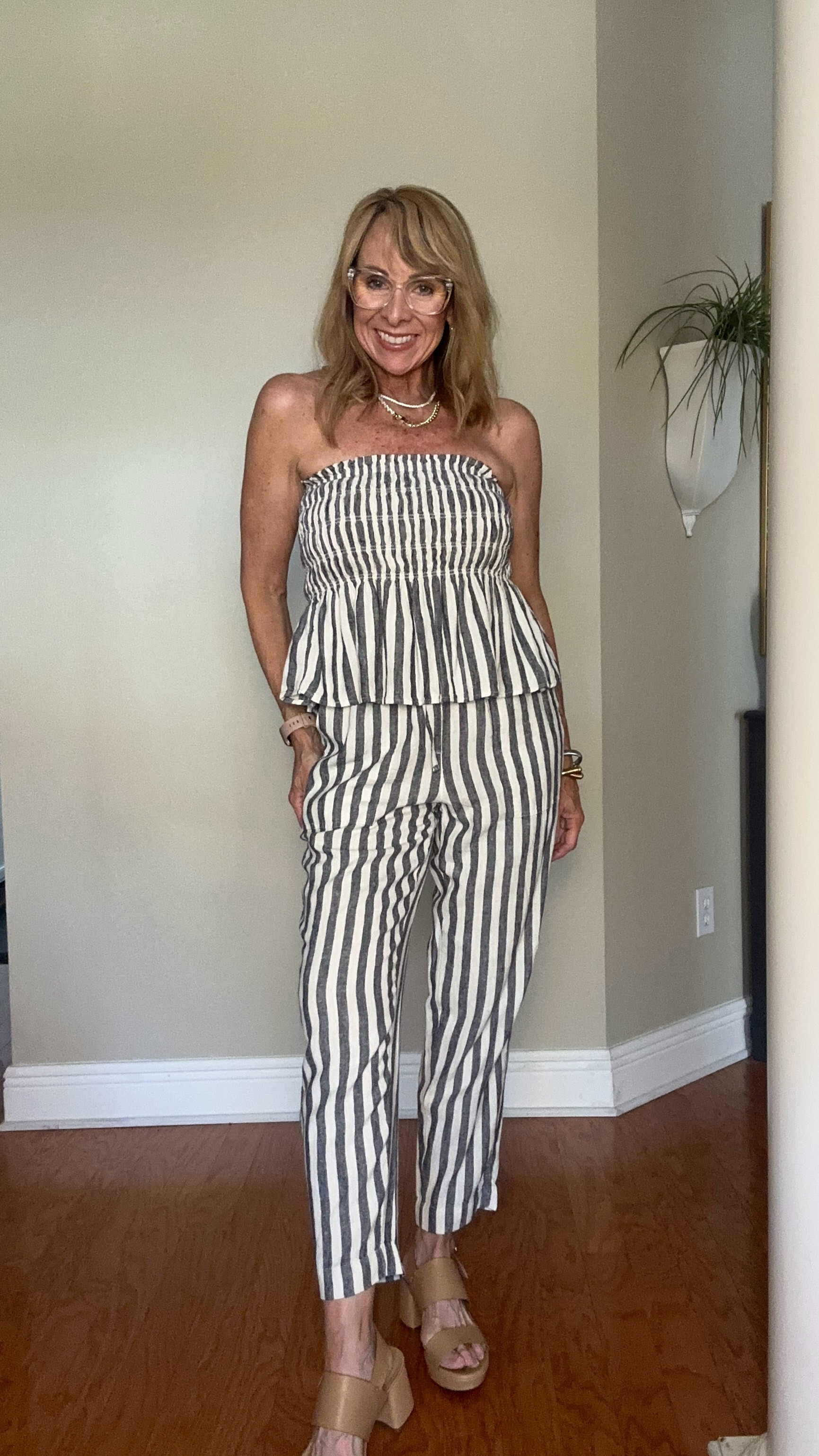 This adorable two piece outfit is going to be perfect for warm weather! The tube top has the flattering peplum and the drawstring waist band on the pants is vacation friendly! 
You could add a jacket, blazer, or cardi around the shoulders. I dressed it up with my jewelry and these platform heels but flip flops would work just as well!


#LTKWatchNow #LTKOver40 #LTKFindsUnder50
