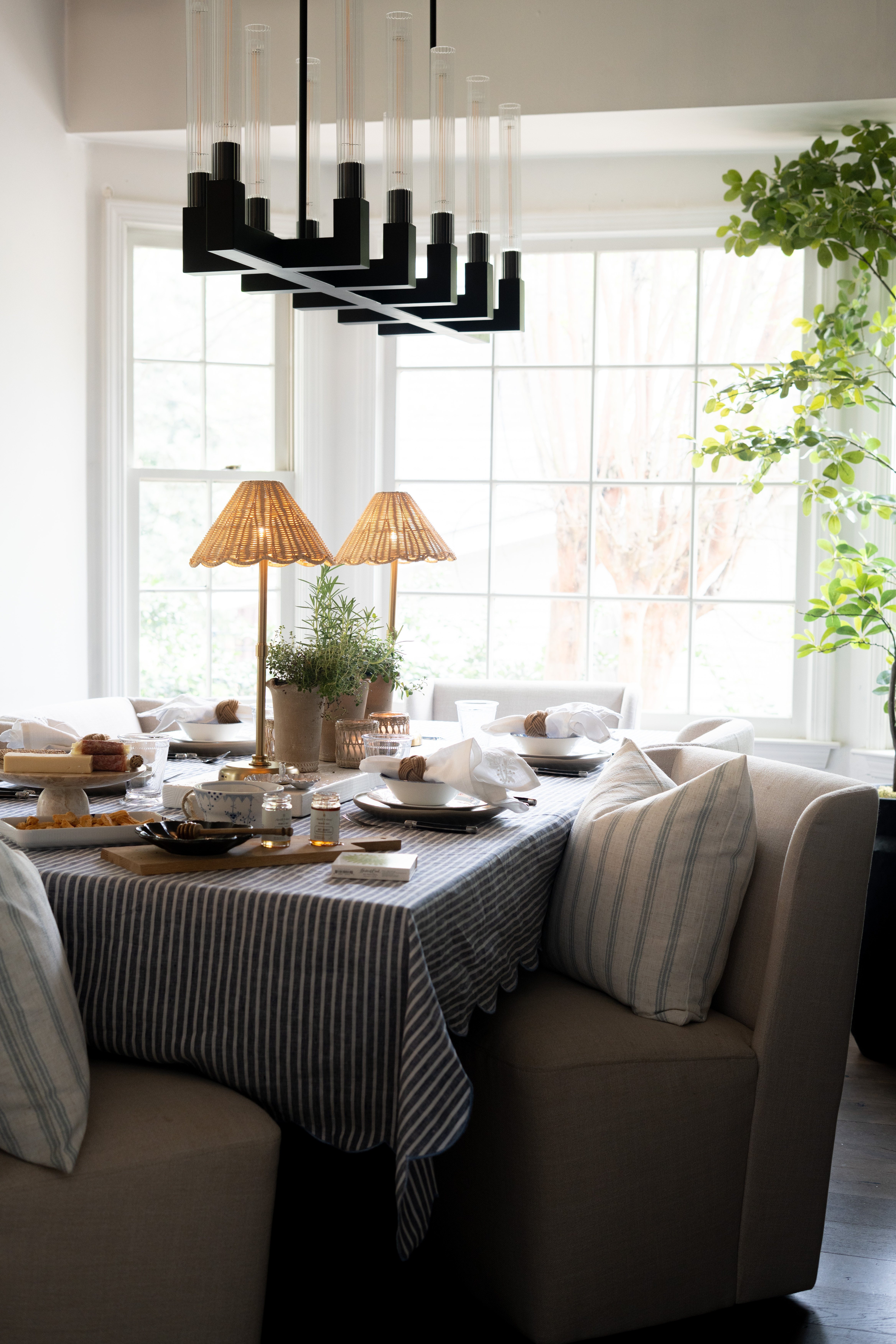 This is my kind of table. A layered blue and white tablescape with striped linens, warm lighting, and natural textures creates such an inviting, elevated feel. I always focus on simple, intentional details to make hosting feel effortless and organized. I am loving the colors for this spring!!! 

 #LTKSeasonal #LTKHome #LTKSaleAlert