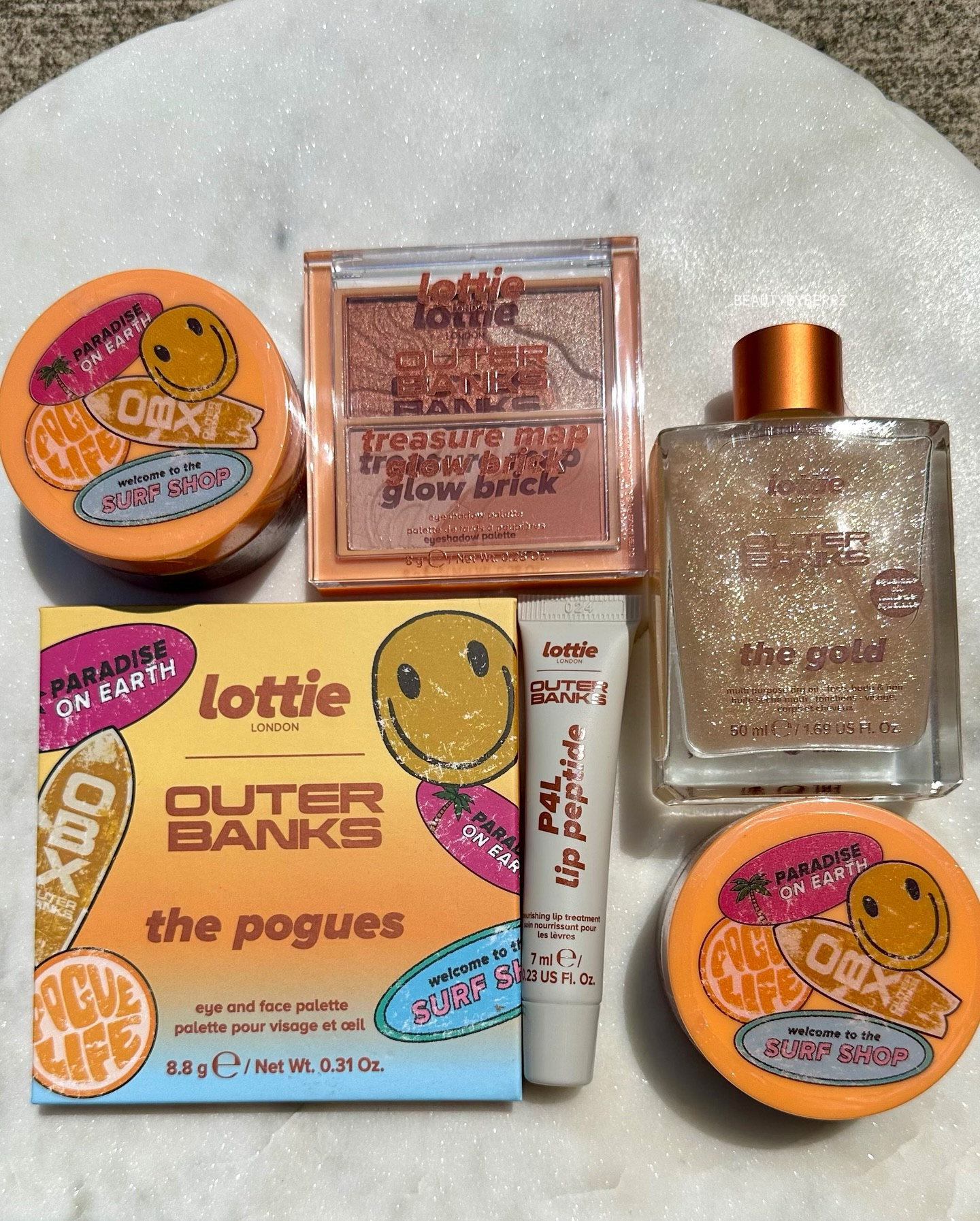 @lottielondon recently collaborated with @netflix ‘s @obx and sent over the entire collection! These goodies are perfect for the warmer weather! 

Lottie London x Outer Banks Products:
👄 P4L Lip Peptide Balm in Caramel Glaze
✨ Treasure Map Glow Brick
✨ The Pogues Face & Eye Palette
✨ The Gold Multipurpose Dry Oil
👄 Kookproof Lip & Cheek Balm in Dusky Pink & Beach Bronze 

Other Lottie London Goodies:
💎 Diamond Bounce Illuminating Highlighter in Frosted
✨ Ombré Blush in Haze
🍑 Plumped AF Sheer Plumping Lip Gloss in Peach Please

#LTKBeauty