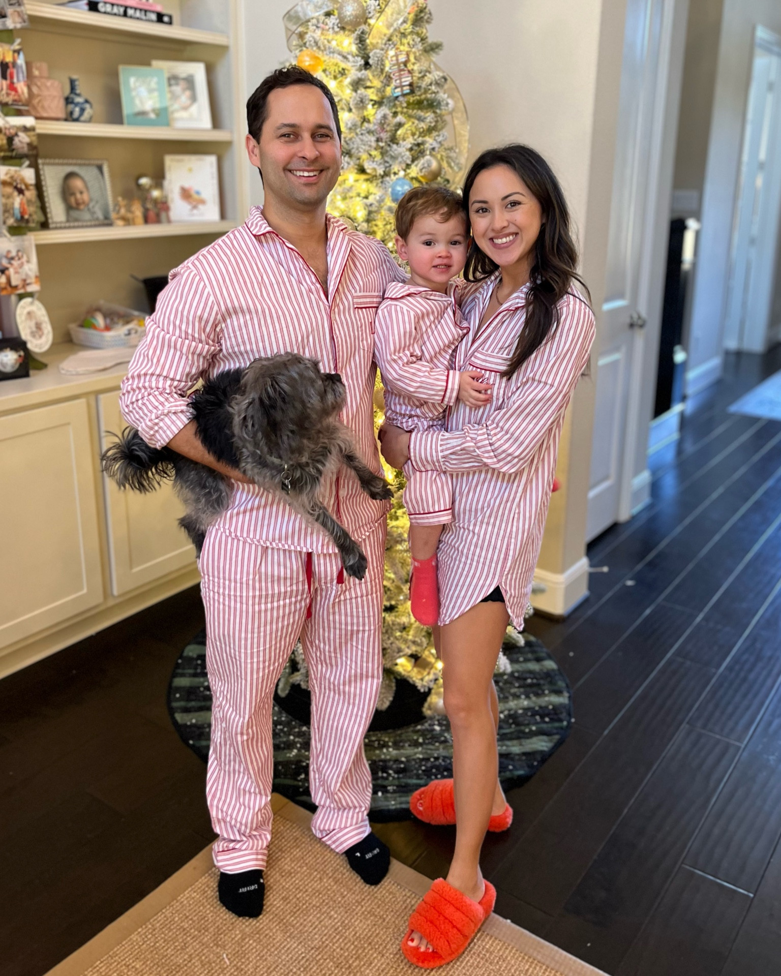 Third year in our red pin stripes! I just get Joe a new set every year and Lindsay and I rewear ours. 25% off sitewide with code BLACKFRIDAY

#holidaypajamas #familypajamas #christmasjammies #christmaspajamas 

#LTKCyberWeek #LTKHoliday #LTKFamily