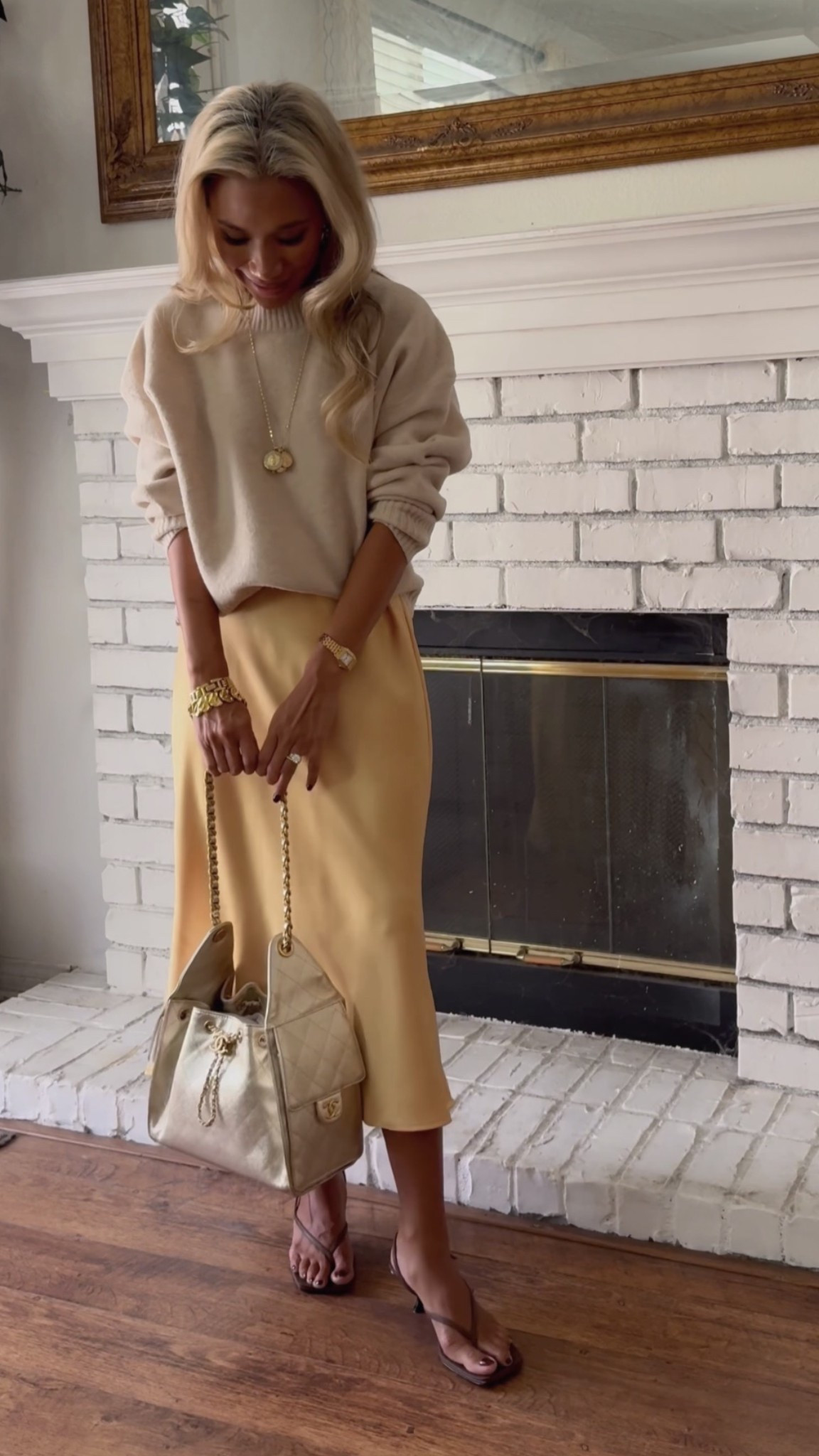 ZARA SATIN MIDI SKIRT STYLING! Perfectly paired with a nice soft neutral sweater. Both Zara pieces are in XS. The Row sandals, chanel25 bag. 

#LTKFindsUnder50 #LTKPetite #LTKSeasonal