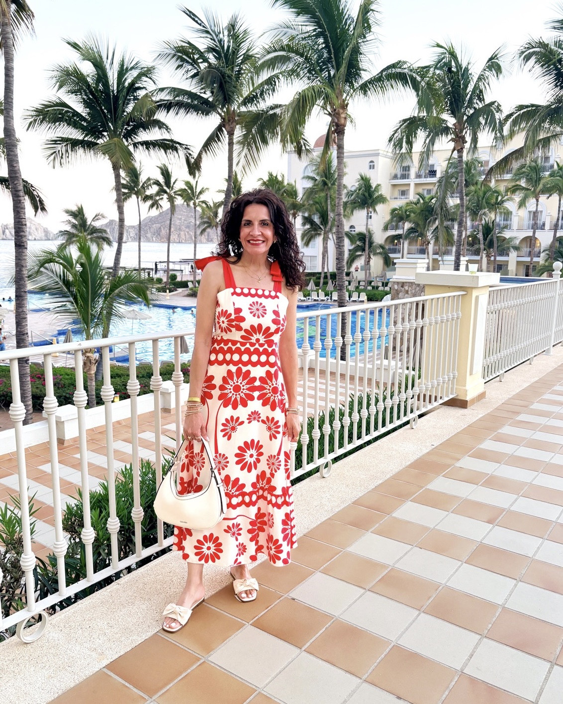 This dress was made for Cabo. ☀️ The vibrant floral print, breezy fit, and feminine bow straps made it the perfect vacation look for strolling the resort before dinner. I love finding pieces that are affordable, comfortable, classy, and easy to pack 😉and this one checked every box!

I’ve linked this dress, my sandals, a similar handbag, and accessories in my LTK so you can recreate the look for your next getaway.

🤍 Follow me on LTK for more affordable vacation outfits, travel style, and everyday favorites! #CaboStyle #Maxidress

#LTKOver40 #LTKTravel #LTKSaleAlert