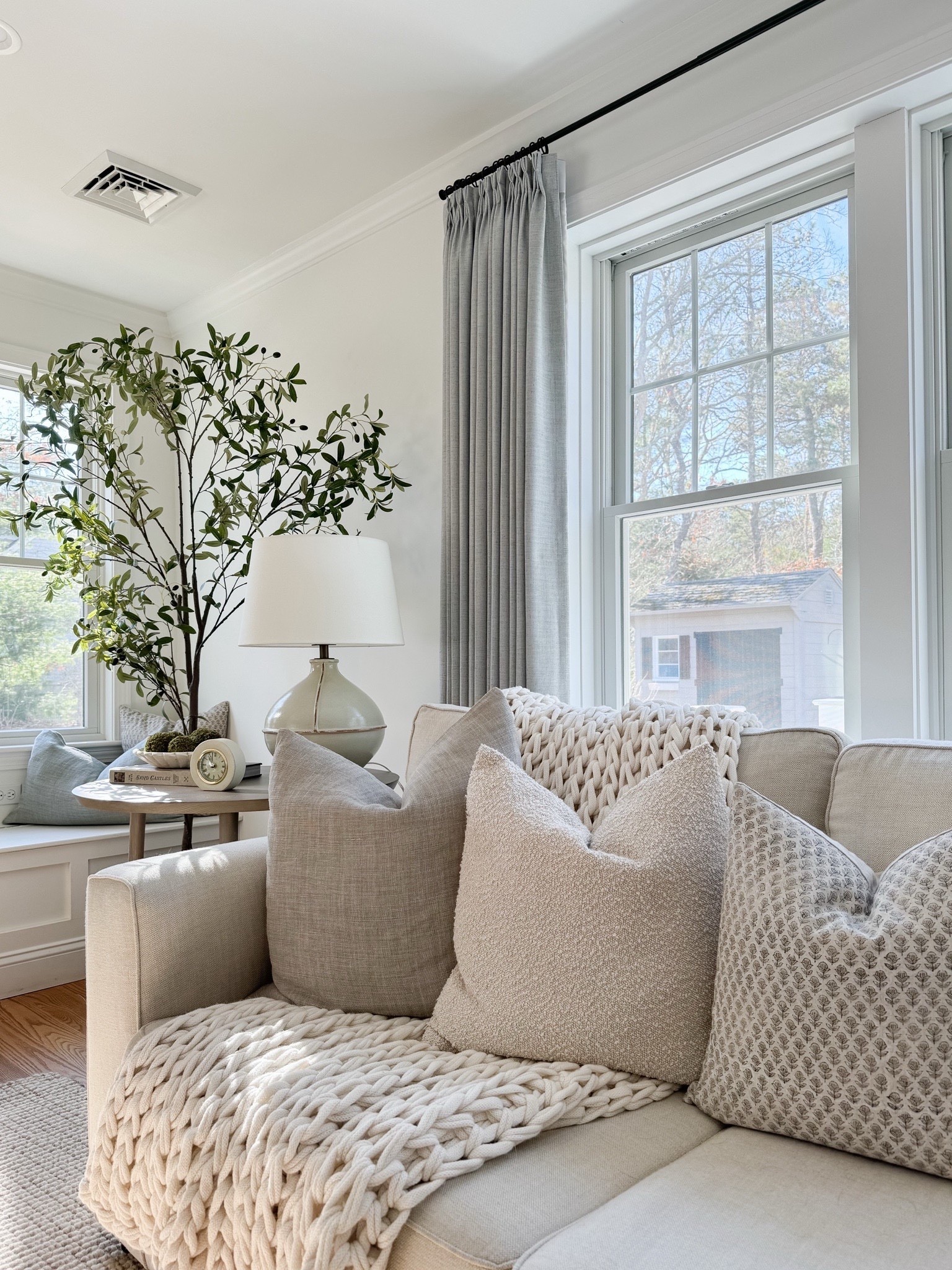 This cozy corner is a favorite spot during all seasons! 🤍 I’m shocked these throw pillows are still in stock. I also was happy to see that our wool rug is on sale right now, and so is our couch! Linking a similar faux olive tree from Amazon, which is affordable and looks so lifelike.

#LTKHome #LTKSeasonal #LTKSaleAlert