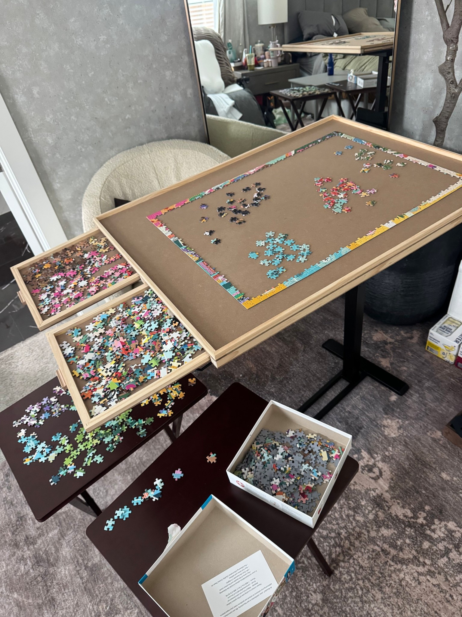 Rotating puzzle board that also stores unfinished puzzle pieces for easy organization and access!