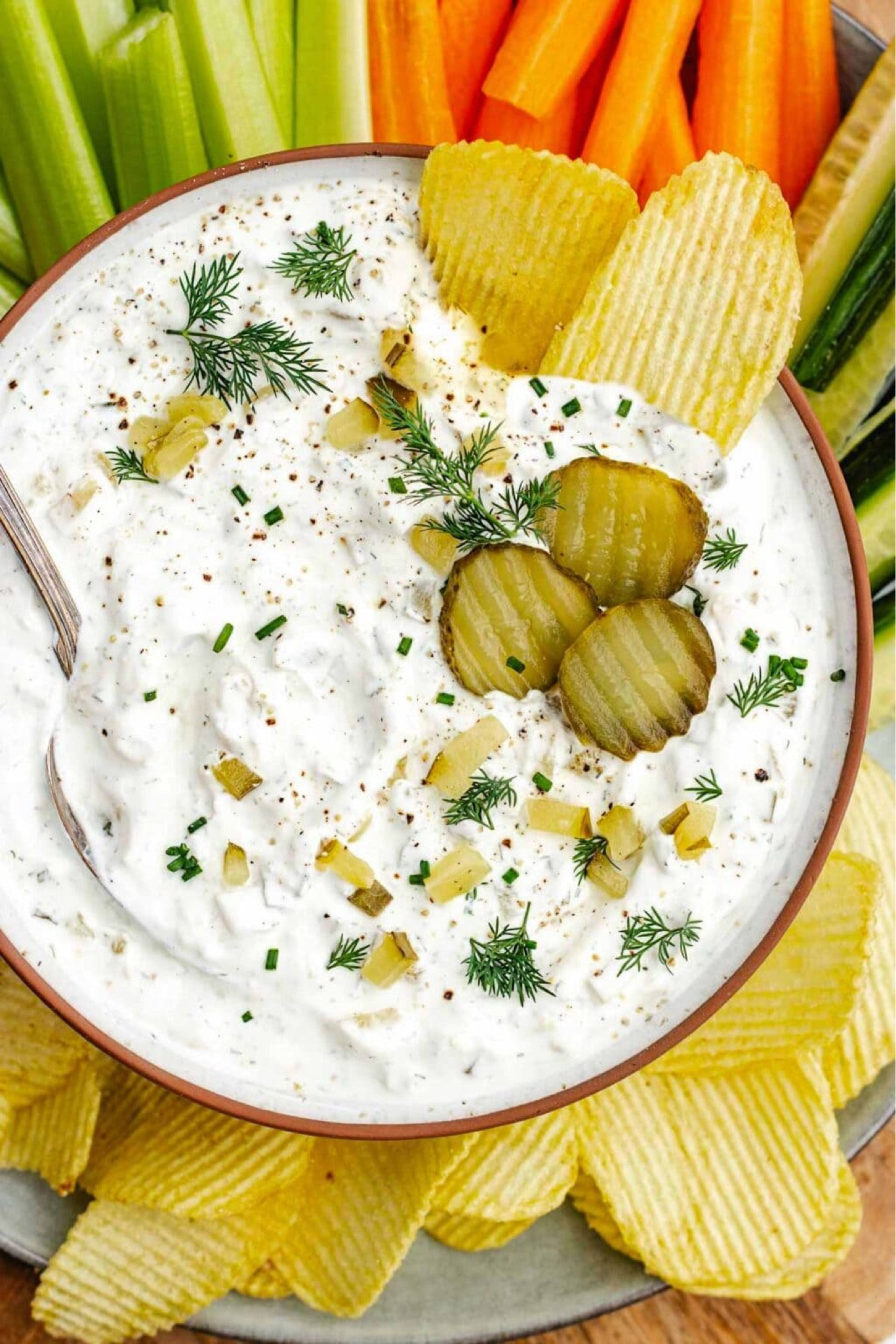 This easy Dill Pickle Dip is creamy, tangy, and full of flavor. It’s made with minimal ingredients and can be made in advance. Whether you’re hosting a game day party, a backyard BBQ, or just want something tasty to snack on with friends, this dip is the perfect addition to any spread and always a crowd pleaser! Full recipe on my blog: https://www.twopeasandtheirpod.com/dill-pickle-dip/

#LTKFindsUnder50 #LTKHome #LTKFindsUnder100