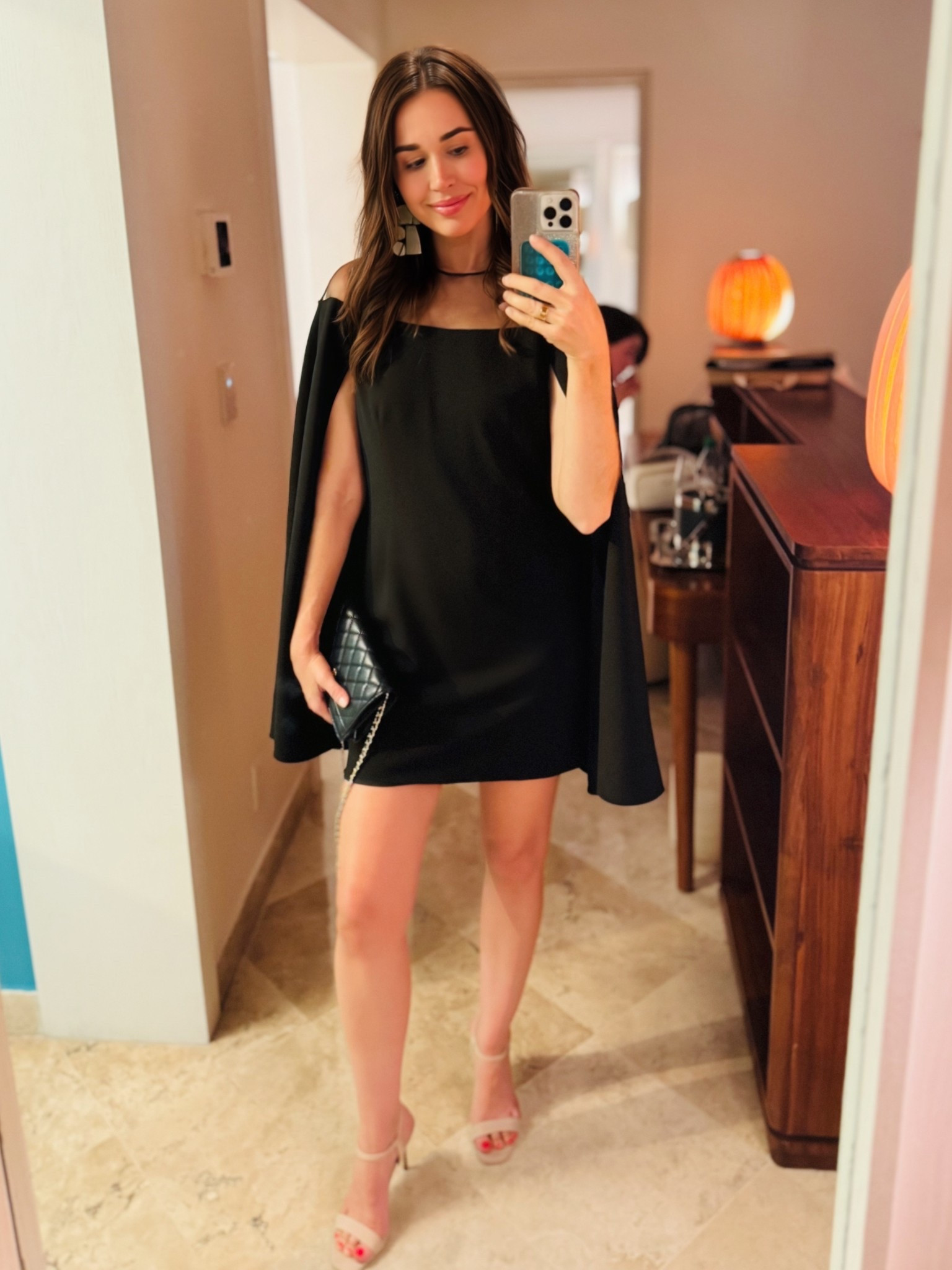 Dinner look. A cape adds instant elegance to an LBD. (And as someone who is always cold, I love this feature. No carrying around a cardigan or a wrap.) 

#LTKOver40 #LTKWedding #LTKSeasonal