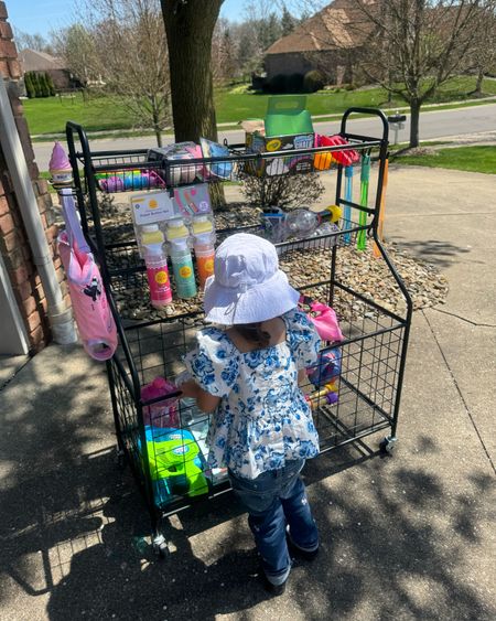 Second year using our outdoor toy cart organizer! You can store so much in this and just wheel it out each day for lots of summer fun. It helps keep little things organized like bubbles, chalk, pool toys, balls, etc. 

Toy organization. Garage organization. Toddler activities. Toddler outdoor play. Summer activities. Toddler must haves. 

#LTKkids #LTKfamily #LTKSeasonal