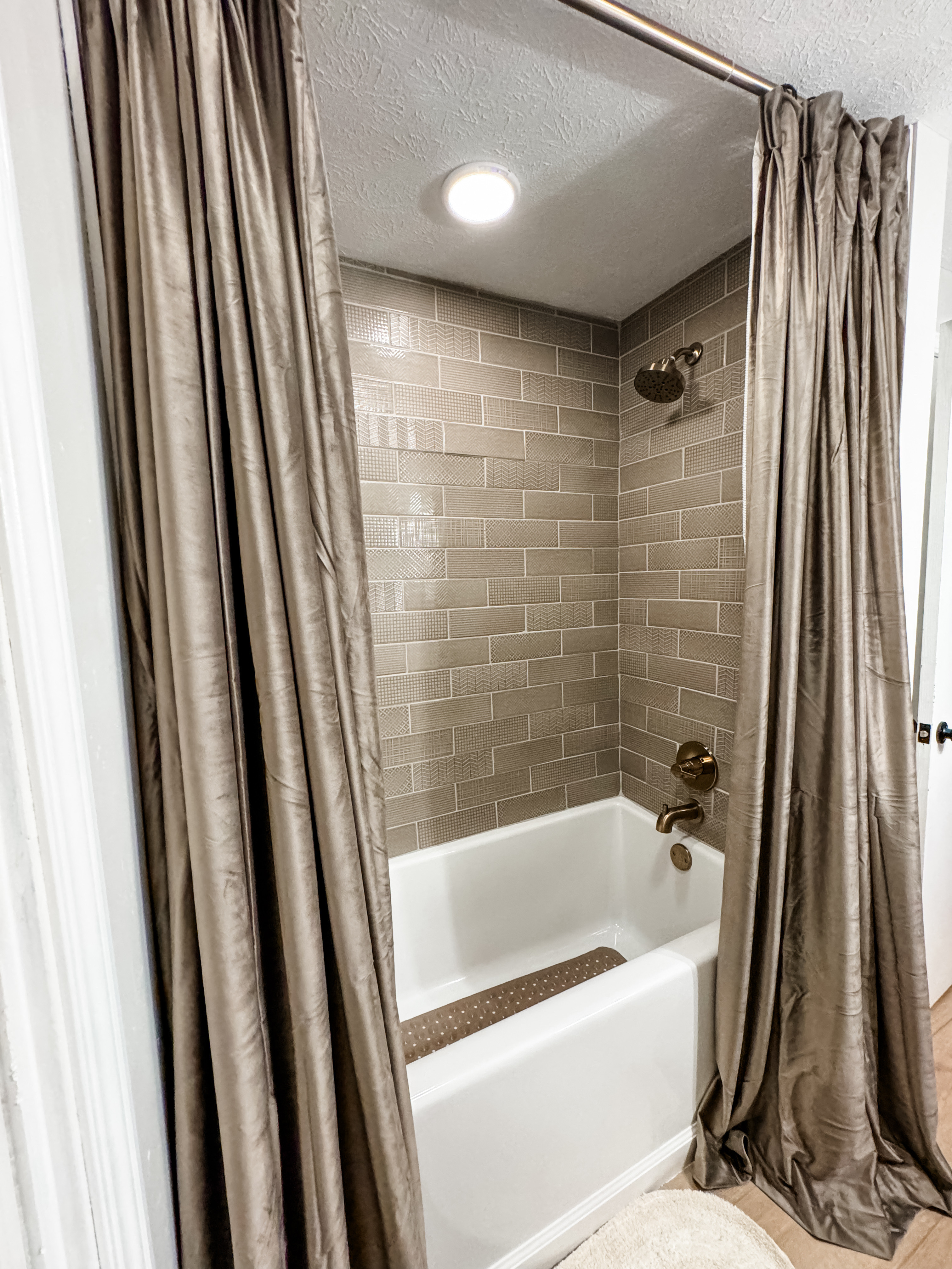 Instead of a shower curtain, use two extra long velvet curtains and hang them all the way up to your ceiling. It makes your bathroom look more elegant and grand! 

#LTKFindsUnder50 #LTKHome #LTKSaleAlert