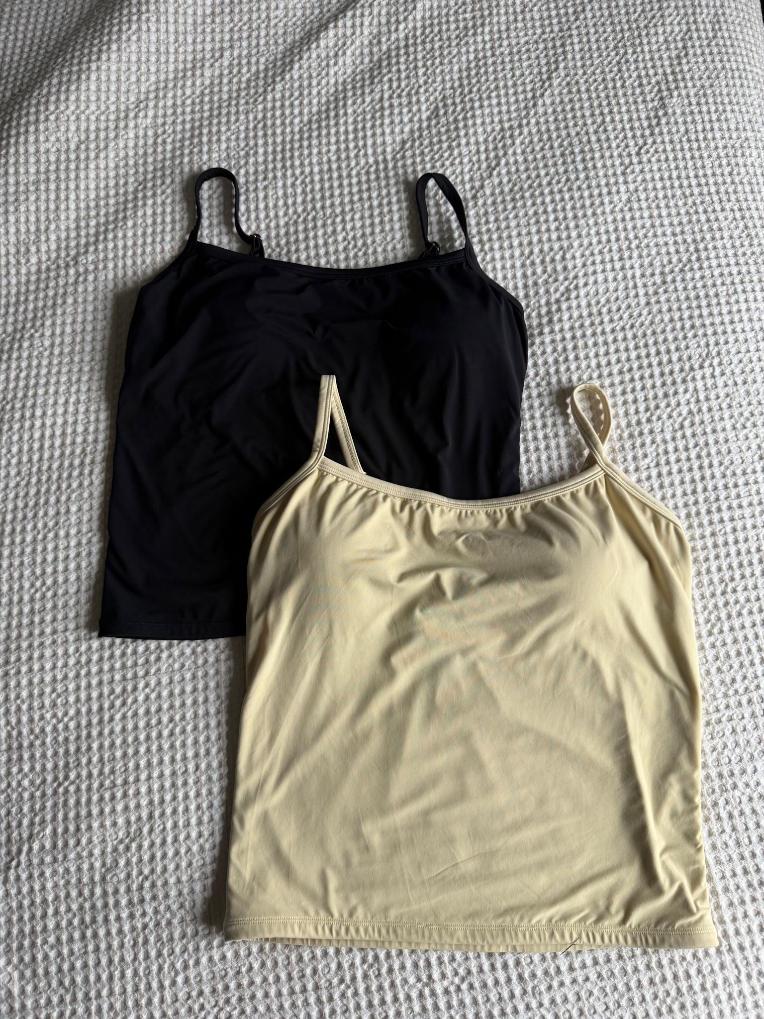 Braless (built-in bra tank tops) from Amazon, these are one of my favorite layering pieces but really easy to pack or throw on with a cute pair of pants in the summer! I wear a size XL ￼