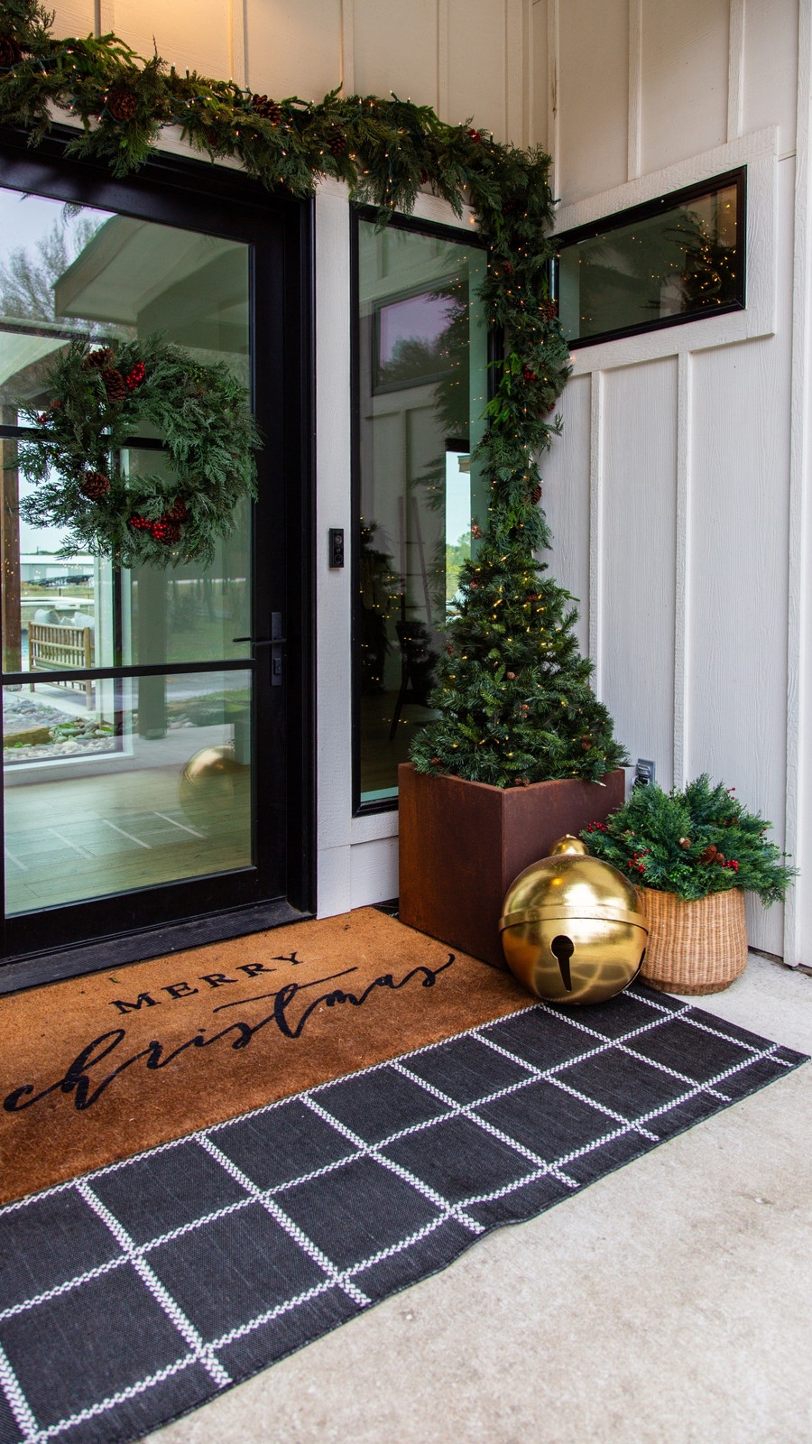 The oversized gold bell and faux greenery garland from Wayfair completely…