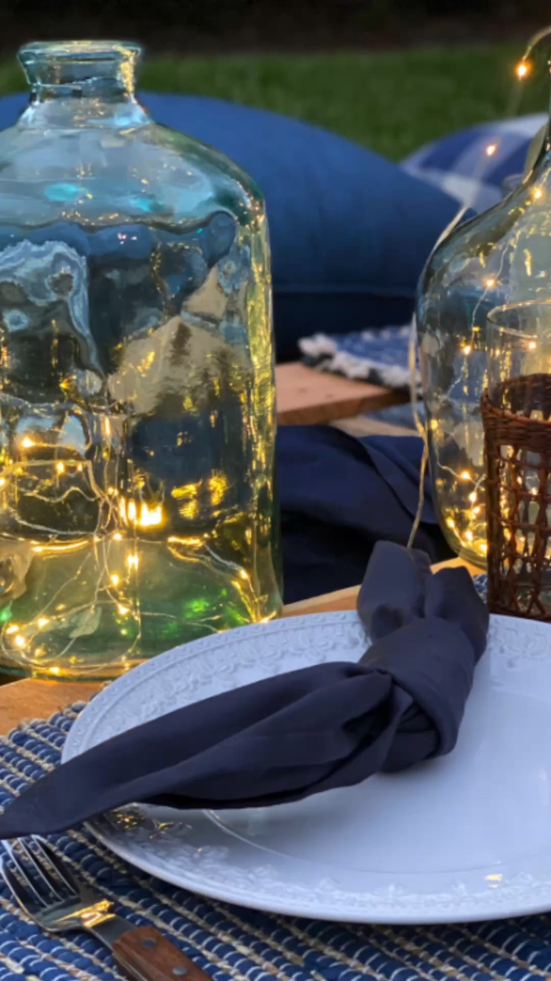 Summer evenings are meant for slowing down and savoring the moment. ✨ This simple backyard picnic came together with rustic wooden pallets, cozy cushions, twinkling fairy lights tucked inside vintage-style demijohn jars, and the magic of a warm summer night.
You don't need a grand setup to create a memorable gathering. A few thoughtful details, soft lighting, and a beautiful outdoor setting can transform an ordinary evening into something truly special. I've linked everything you need to recreate this relaxed summer picnic style—from the lighting to the décor details—to help you bring a little enchantment to your own backyard.
Shop the look and start planning your next summer evening under the stars. 🌿✨

#LTKSeasonal #LTKHome