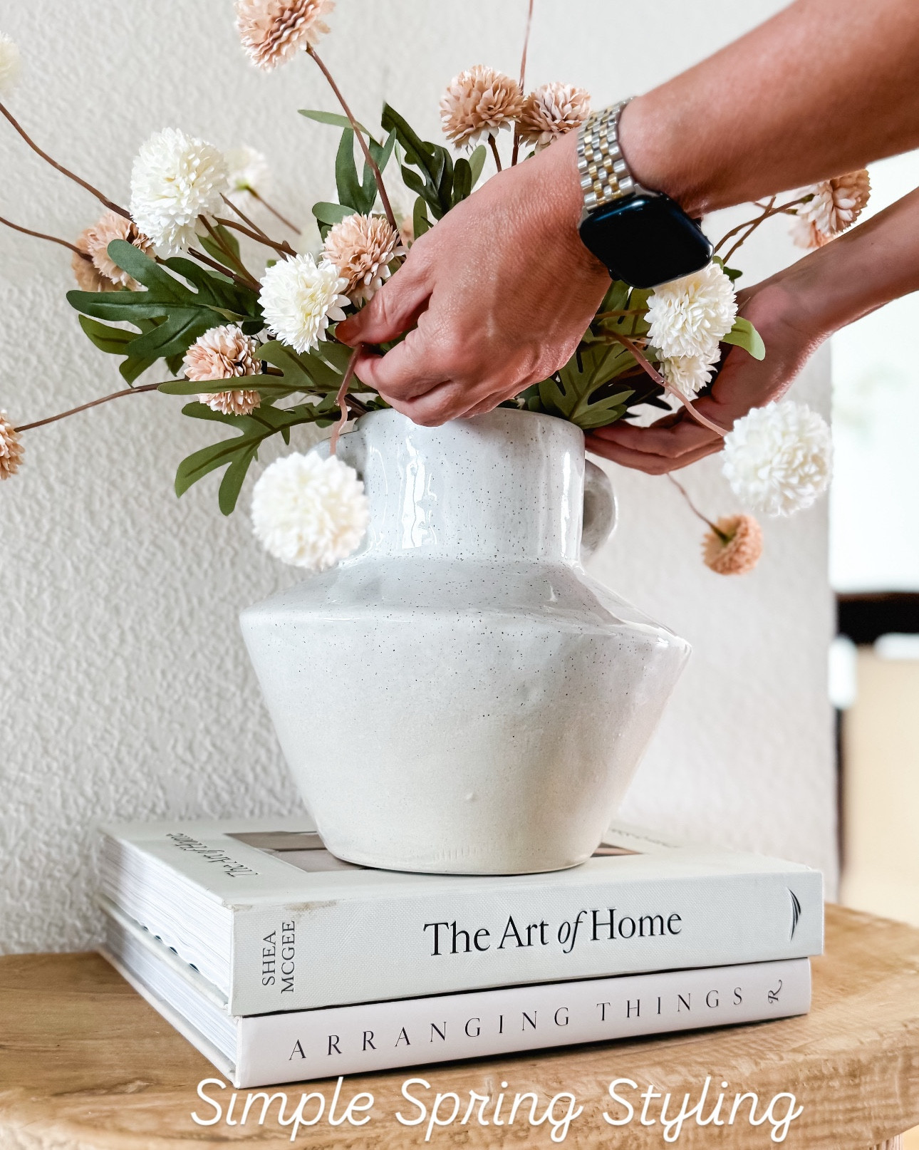 A simple spring styling moment that instantly makes your home feel fresh, calm, and pulled together. I love creating small vignettes like this using neutral decor, coffee table books, and soft florals to bring life into a space without overcomplicating it. These are the little details that make your home feel intentional and lived in. These stems are bendable. My favorite kind of stems  Everything is linked if you want to recreate this look in your own space. Follow me on LTK for daily home decor, Amazon finds, and effortless styling ideas. spring home decor ideas, neutral home styling, coffee table decor styling, small space decor ideas, modern organic home decor, simple home styling tips, faux floral arrangement ideas, home decor inspiration neutral aesthetic

#LTKSaleAlert #LTKHome #LTKSeasonal