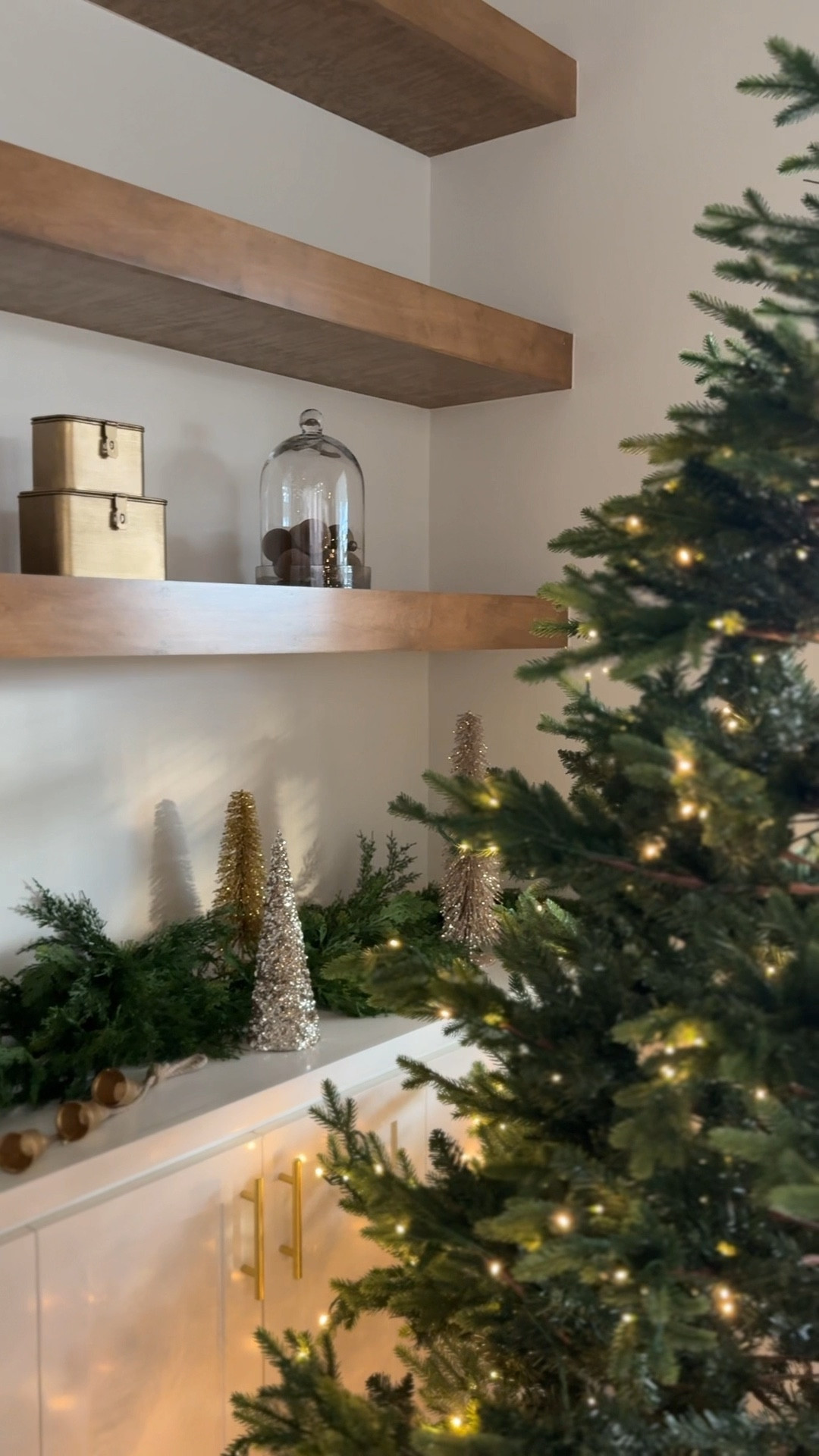 It’s already Christmas time in my house! Faux Christmas tree, artificial Christmas tree with lights, Christmas garland, faux garland, neutral Christmas decor, gold Christmas trees, gold Christmas decor, Christmas bells, velvet Christmas ornaments, flocked Christmas ornaments, Christmas decor ideas, Christmas decor inspo, Christmas decor inspirations, transitional Christmas decor, prelit Christmas tree, Christmas shelf decor, Christmas shelf decorating 

#LTKHome #LTKSeasonal #LTKHoliday