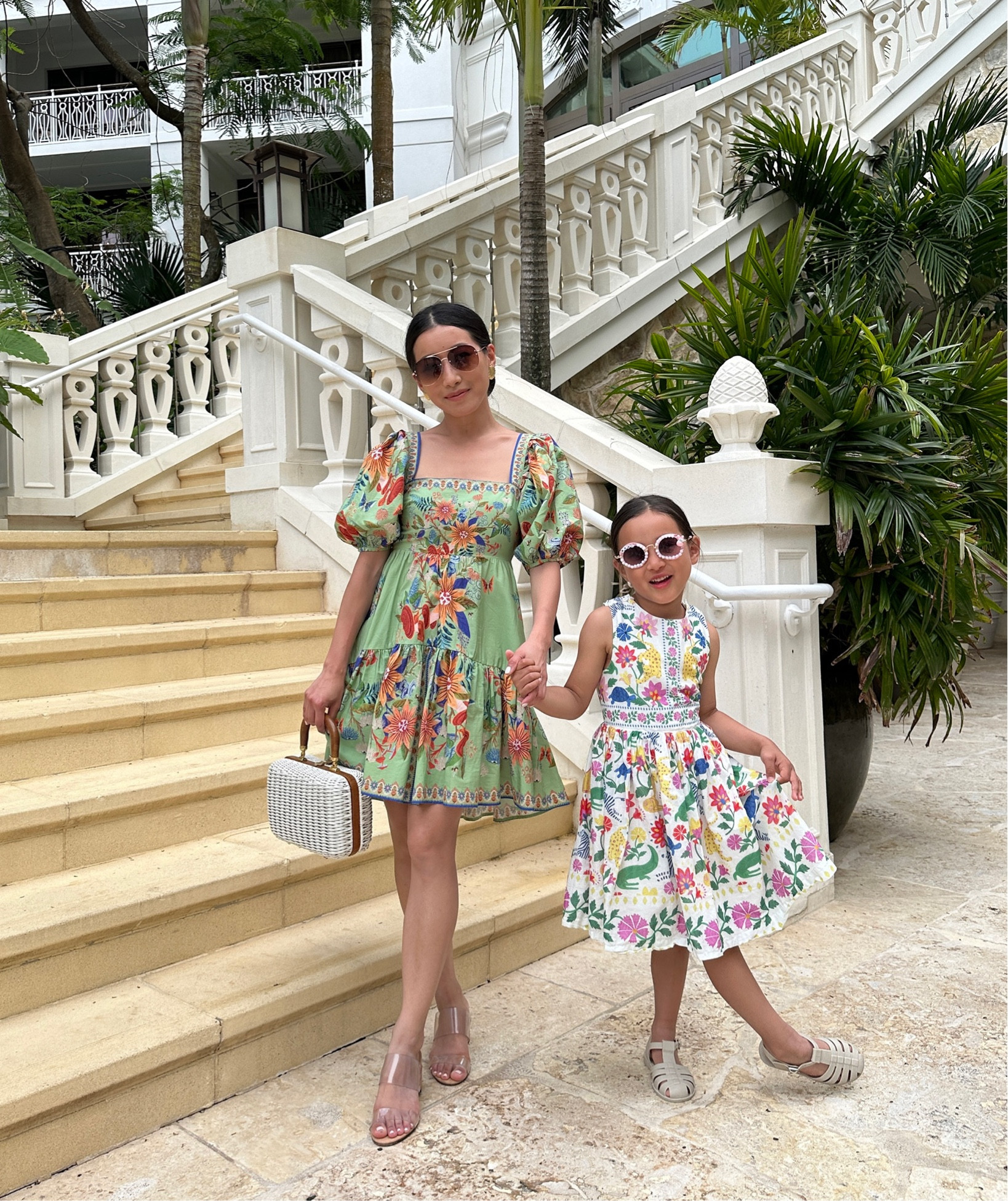 Mom & me colorful dresses

• farm Rio green floral dress xxs very petite friendly and comfortable. also is bump friendly due to smocked back slightly stretchy empire waistline and flared skirt. 

• schutz clear wedges slides, size 5.5 these are very comfy I’ve had for years 

• vintage wicker bag, an eBay find. brand is lesco lorna

• nori is in Boden girls cross back dress, soo cute and well made with cotton lining. I usually go 1 size up for her to grow into for Boden. 

She is age 5.5, In this particular dress a size 6/7 fit her well for this year, but I sized up more to a 7/8 and then sewed the straps shorter so I can undo it later as she grows. 

• her jelly waterproof sandals are liewood from Luisa via Roma (I did pay $15 shipping and it’s still cost lower than other retailers) and we also own the Amazon ones that are great but outgrew their sizing . Love the snap button strap on both!
Beach resort vacation outfits 

#LTKfamily #LTKwedding #LTKtravel