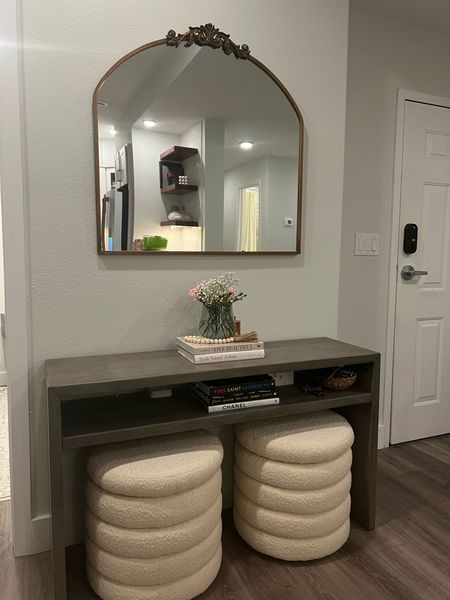 Obsessed with my new boy or storage ottomans under the console table in the entryway! It’s the perfect touch to the foyer with the gold mirror! Modern entryway, foyer,

#LTKstyletip #LTKhome